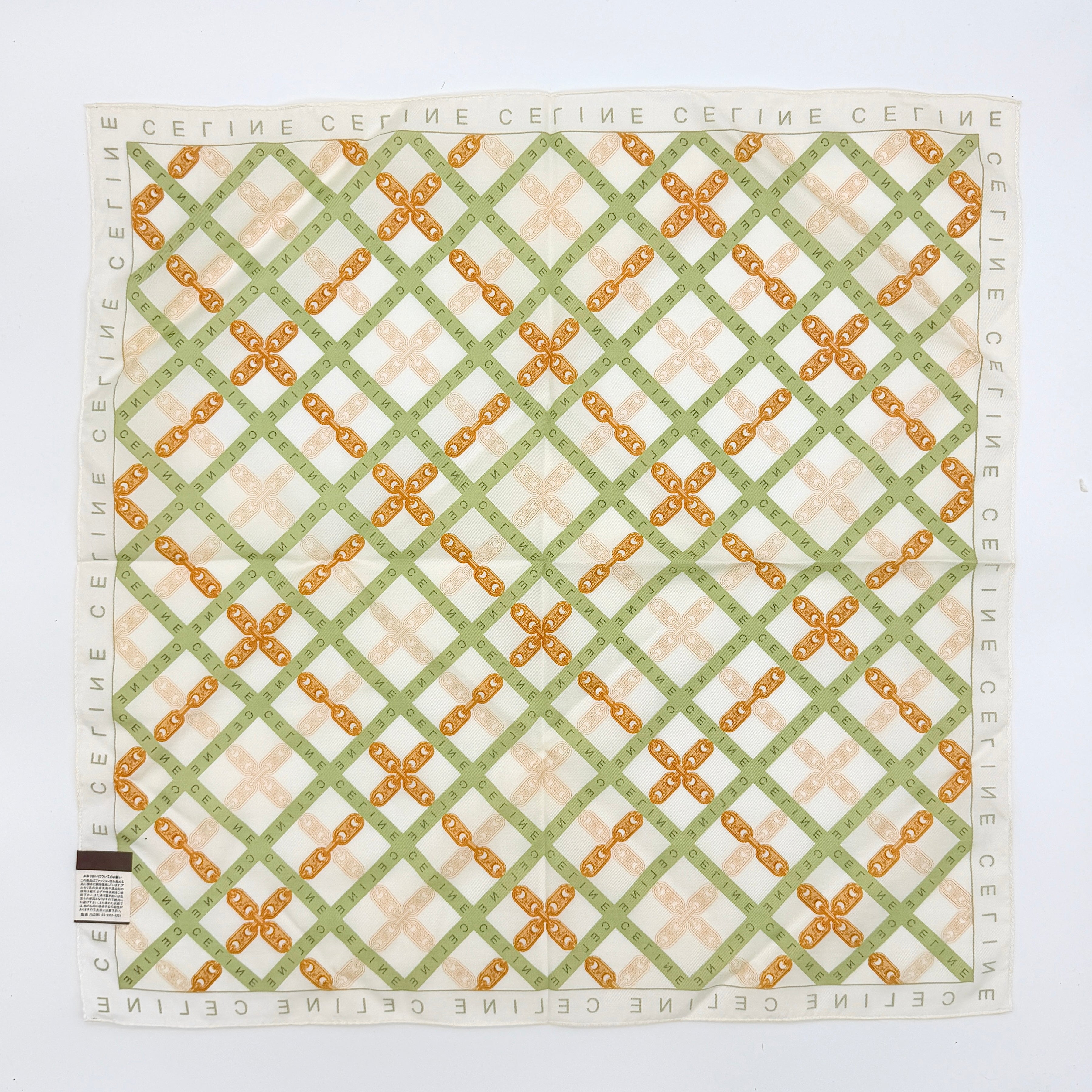 Celine silk and cotton scarf in green and gold chain motif with logo border, displayed with original box.