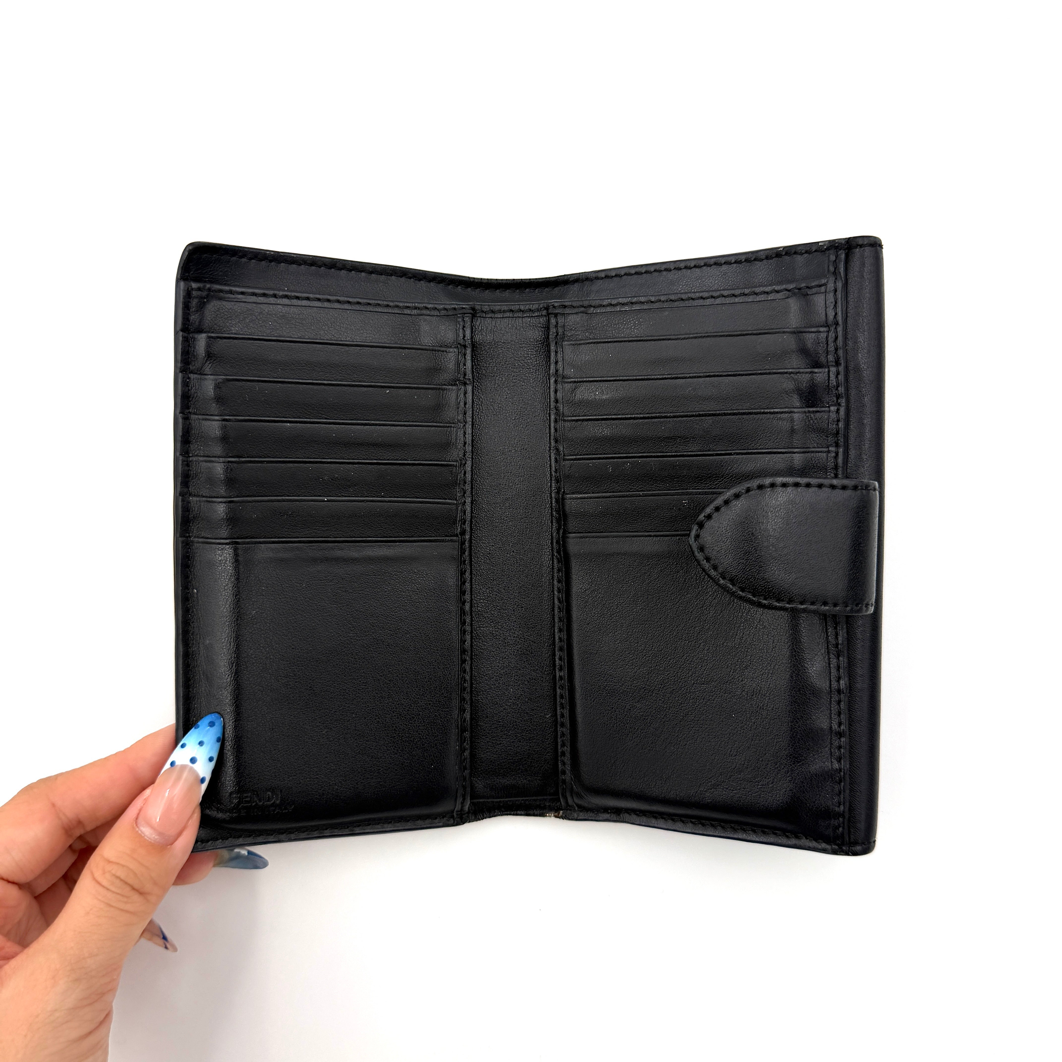 Fendi By The Way Leather Long Wallet in black with gold-tone disc and ring detail on the front flap.
