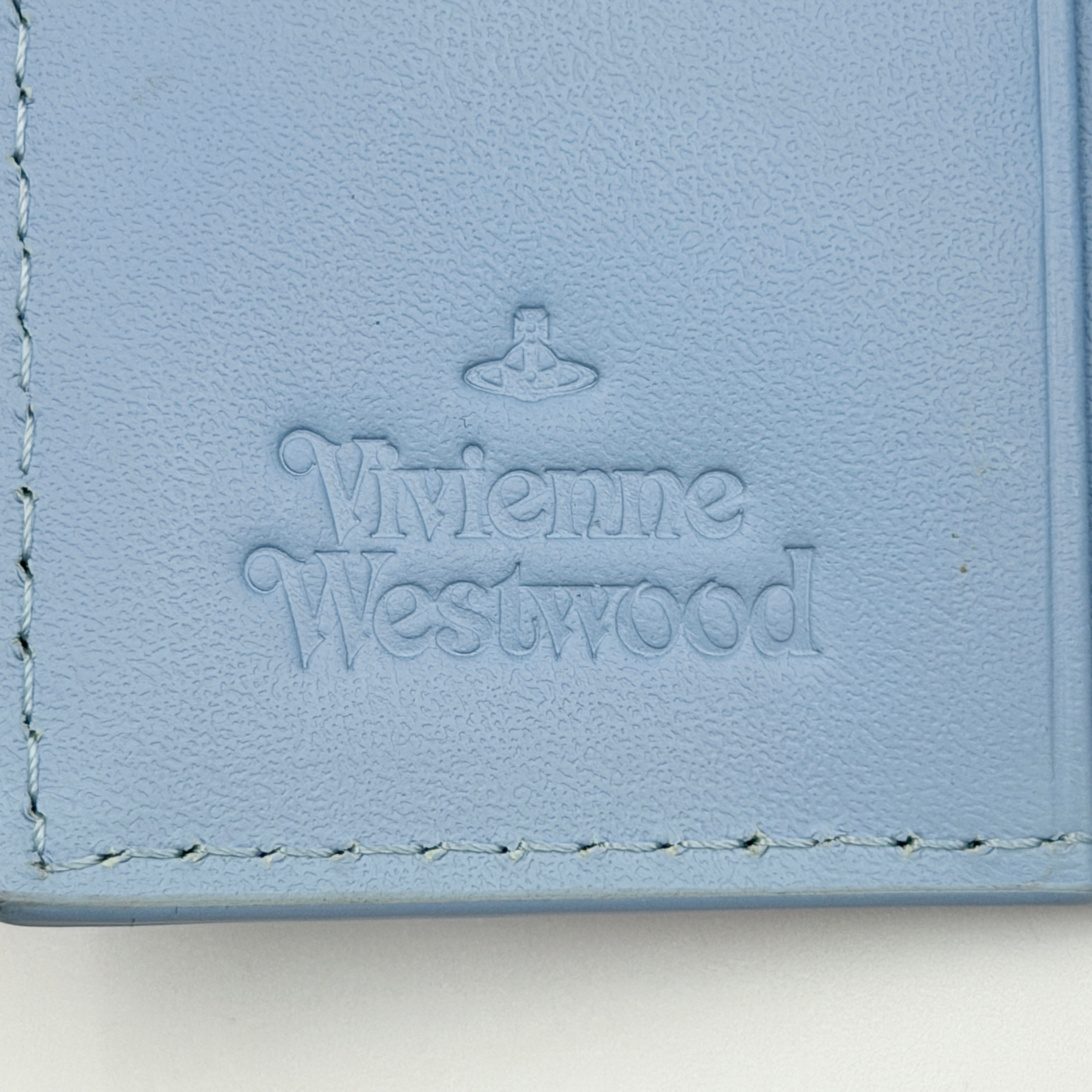 Vivienne Westwood Messy Bugs Key Holder in baby blue leather with a colourful insect motif and silver orb hardware.
