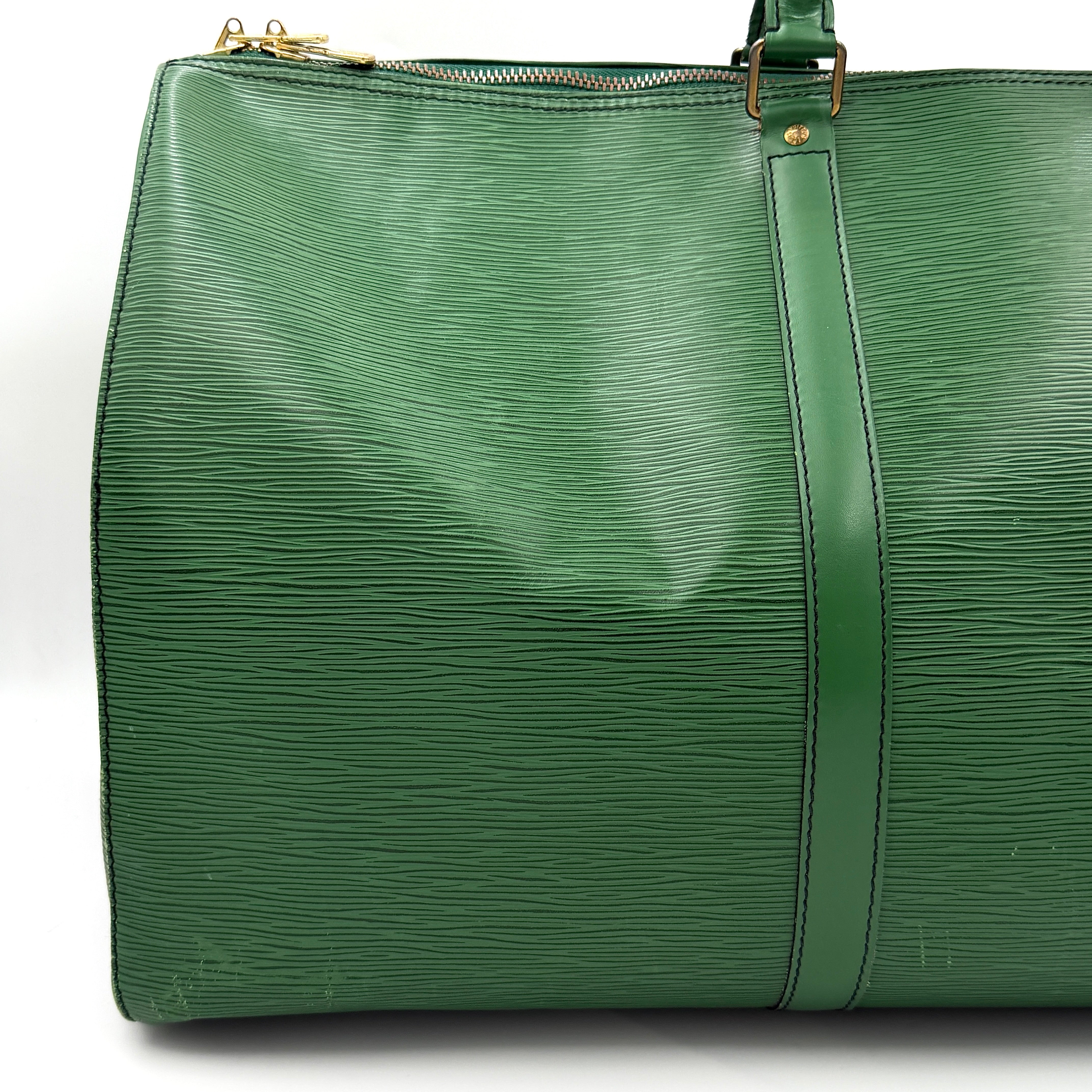 Louis Vuitton Epi Keepall 60 Duffle Bag in textured green leather with double handles and gold-tone hardware.