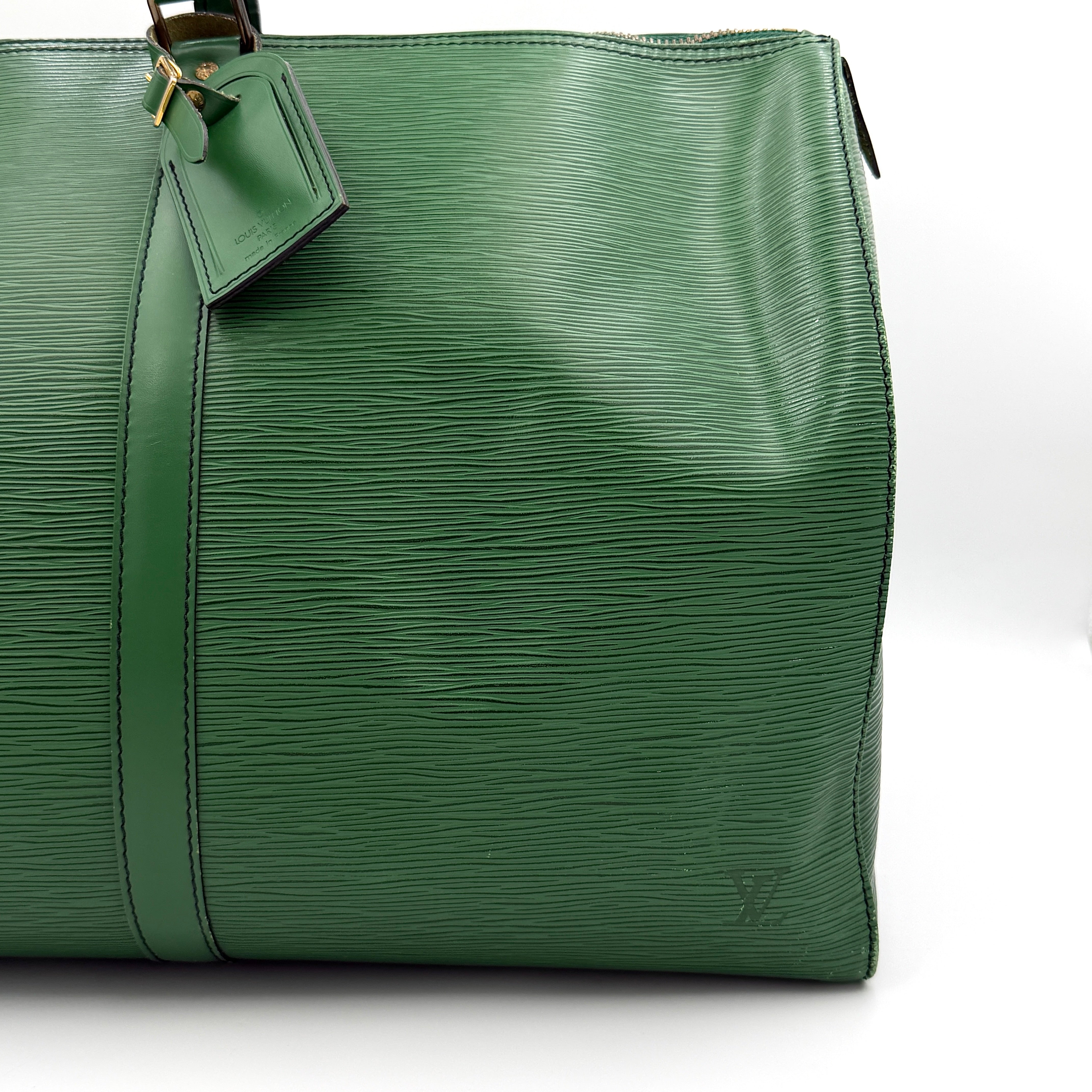Louis Vuitton Epi Keepall 60 Duffle Bag in textured green leather with double handles and gold-tone hardware.