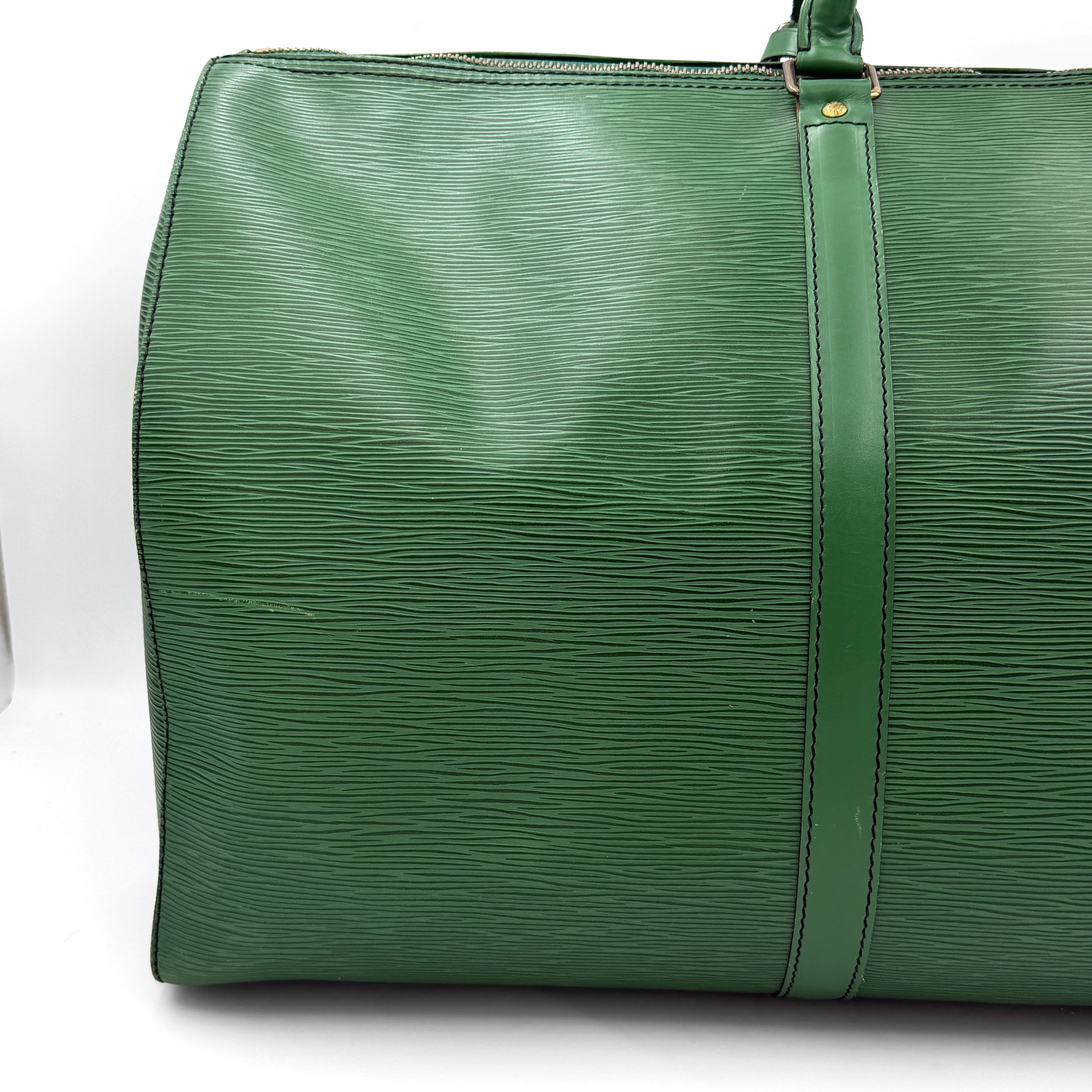 Louis Vuitton Epi Keepall 60 Duffle Bag in textured green leather with double handles and gold-tone hardware.