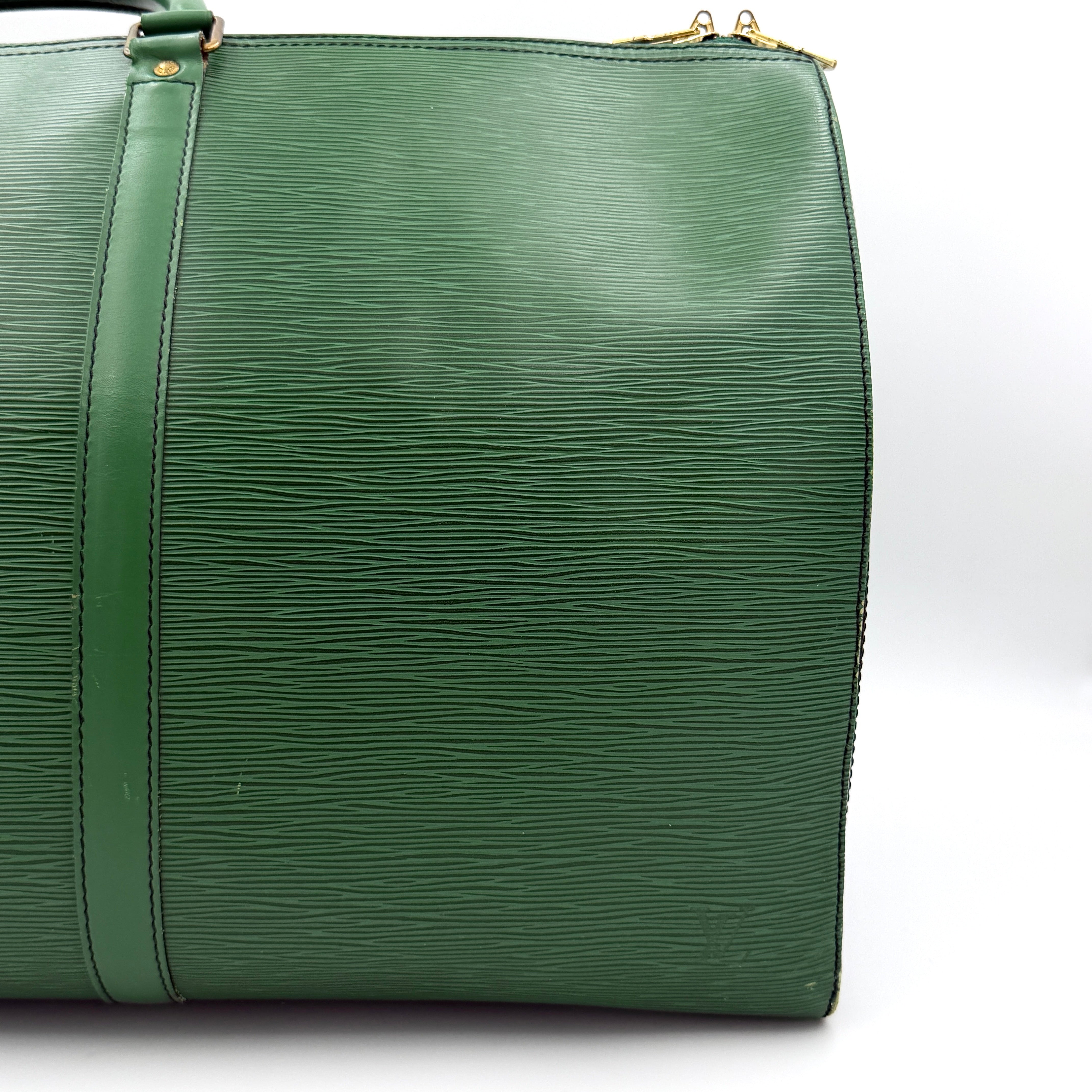 Louis Vuitton Epi Keepall 60 Duffle Bag in textured green leather with double handles and gold-tone hardware.