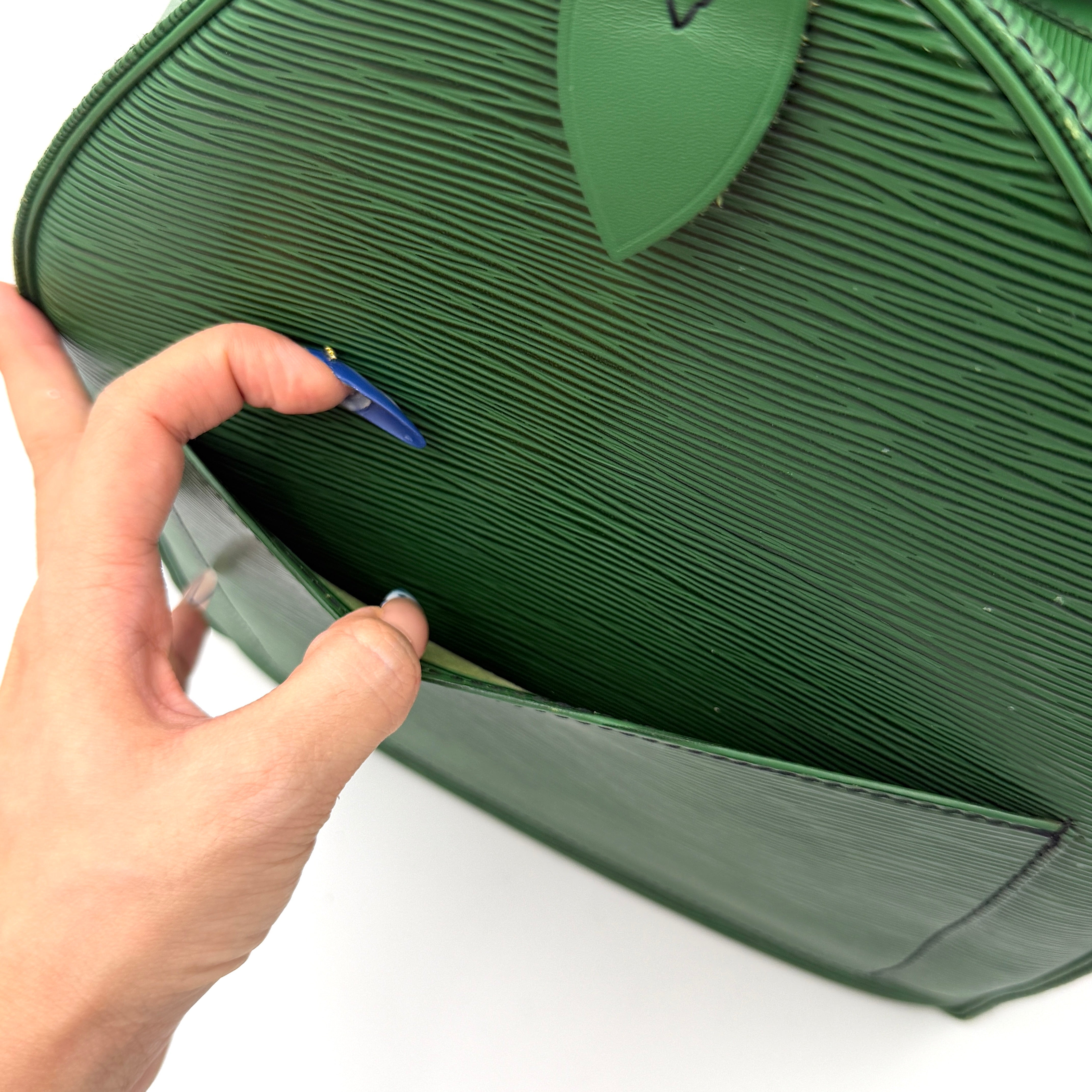 Louis Vuitton Epi Keepall 60 Duffle Bag in textured green leather with double handles and gold-tone hardware.