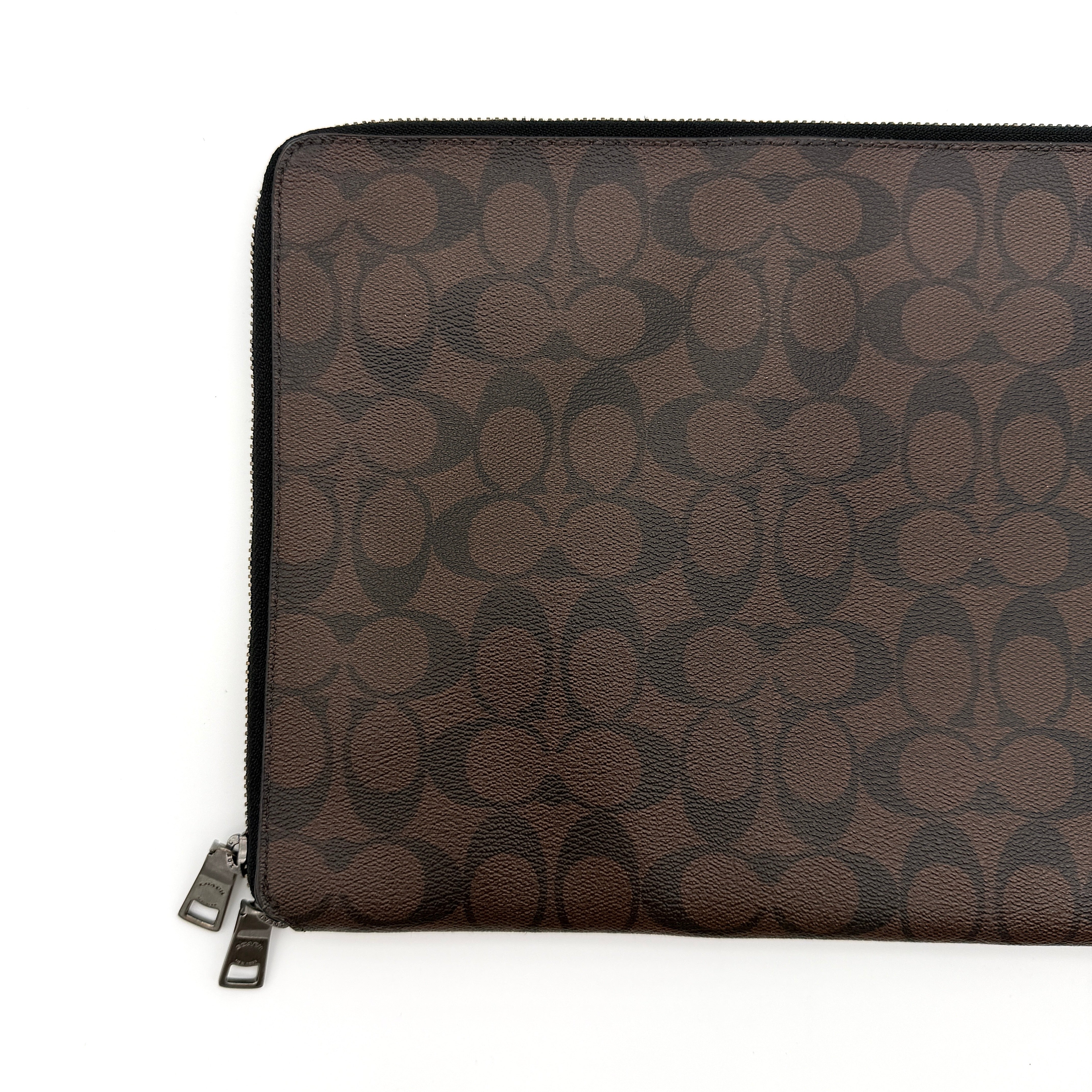 Coach Signature Zip Portfolio in brown and black coated canvas with black leather trim and silver tone double zip closure.