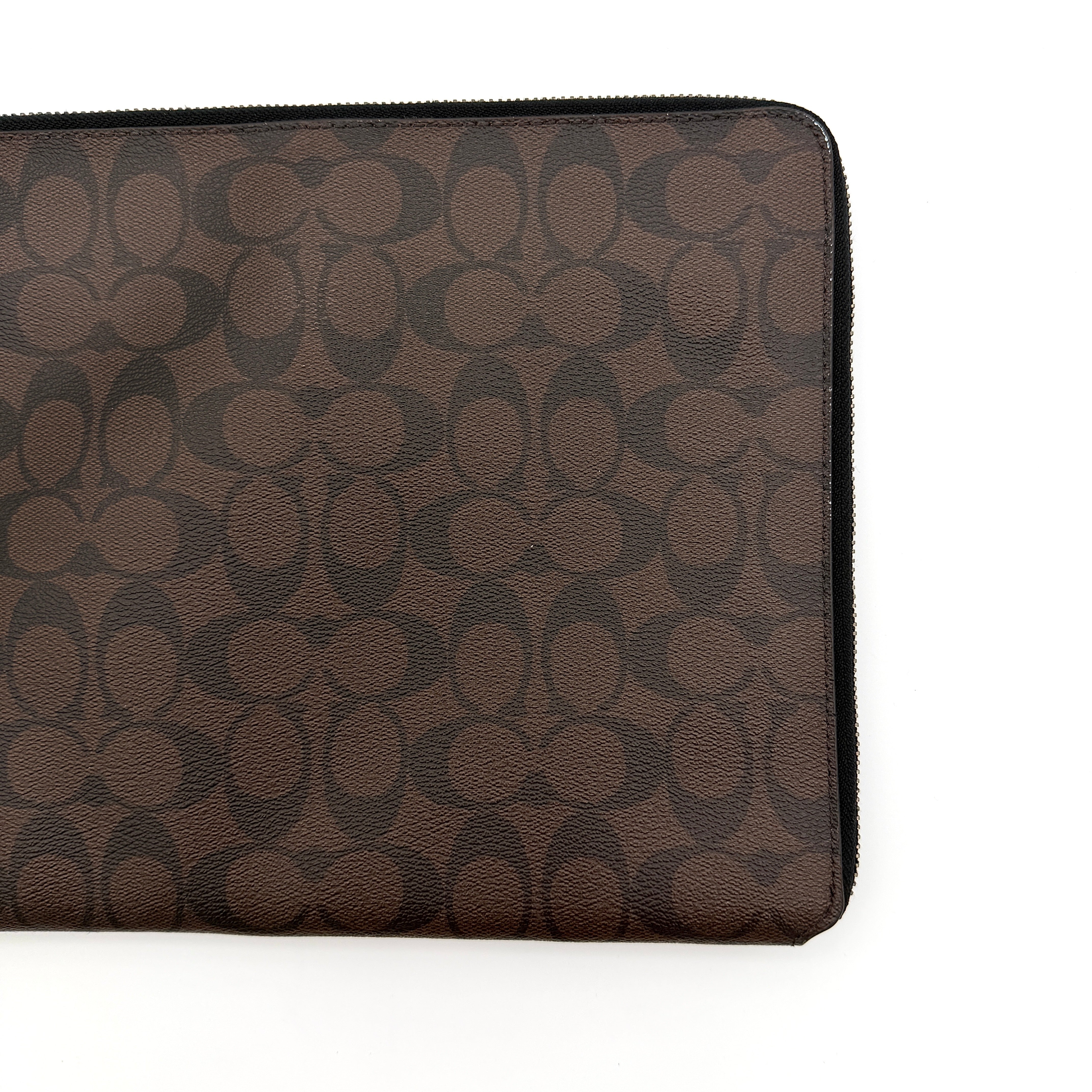 Coach Signature Zip Portfolio in brown and black coated canvas with black leather trim and silver tone double zip closure.