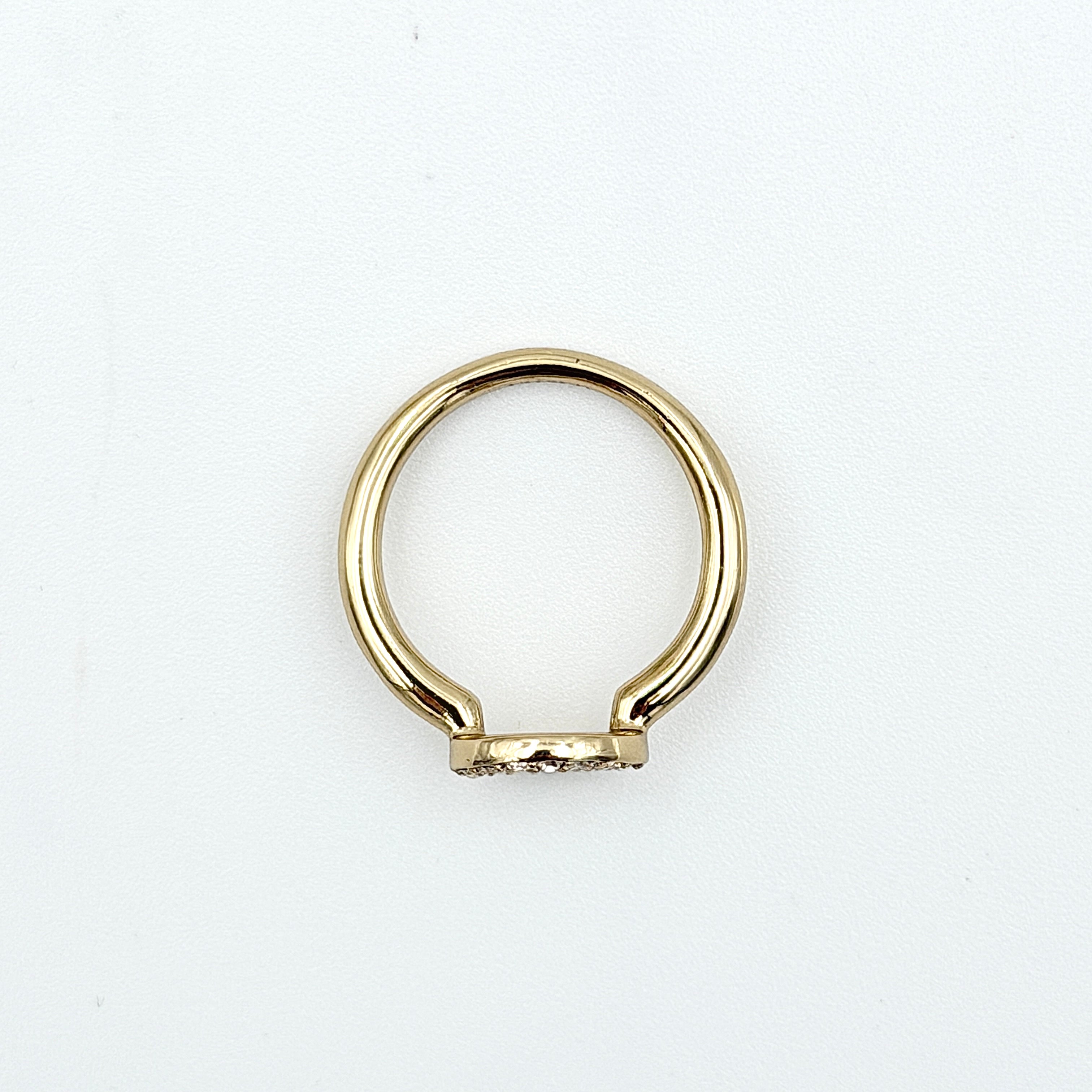 Coach Halo Crystal Ring in gold with a sparkling crystal-studded open circle on a polished gold band.