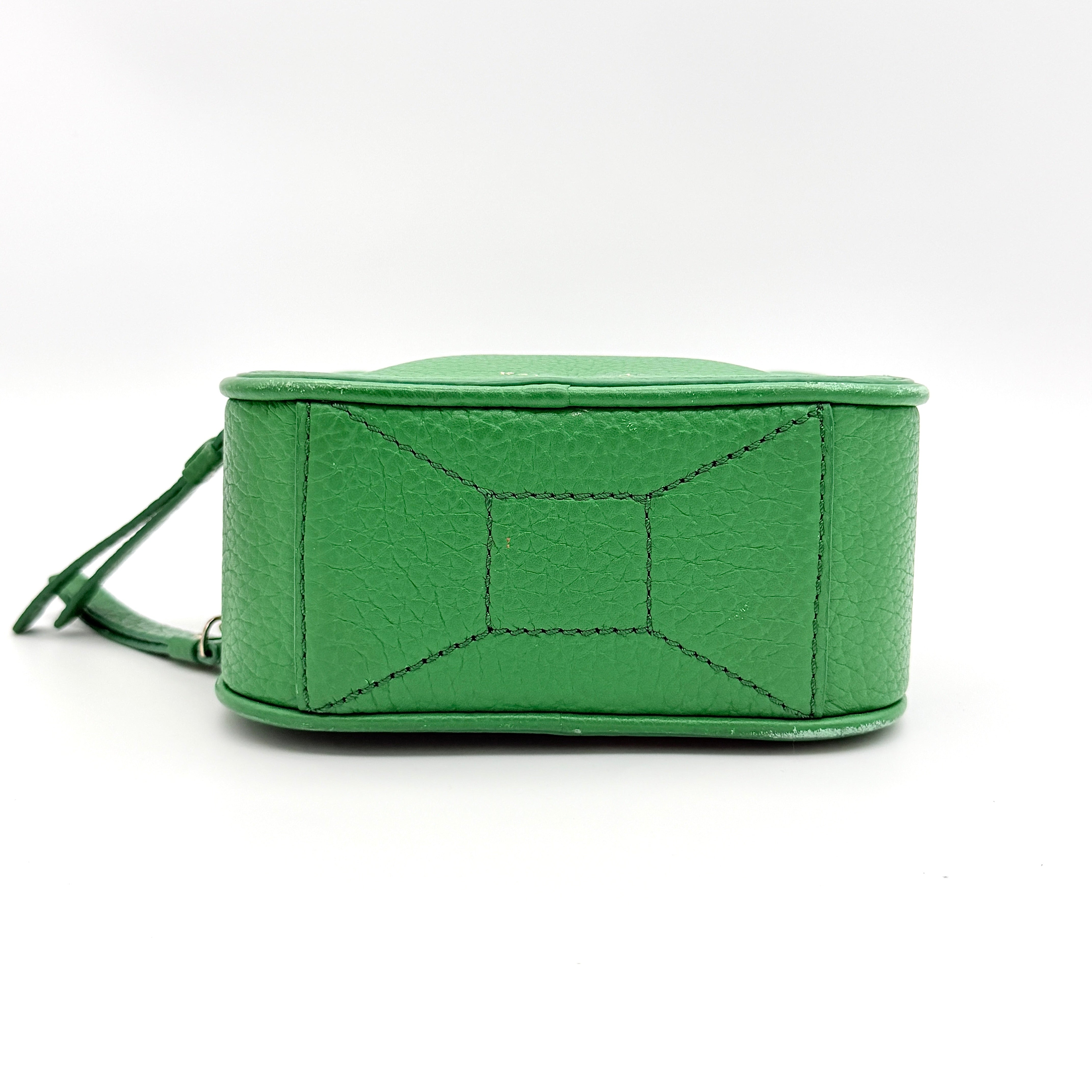 Kate Spade 2Way Vanity Crossbody Bag in bright green pebbled leather with top handle and detachable strap displayed in studio lighting.