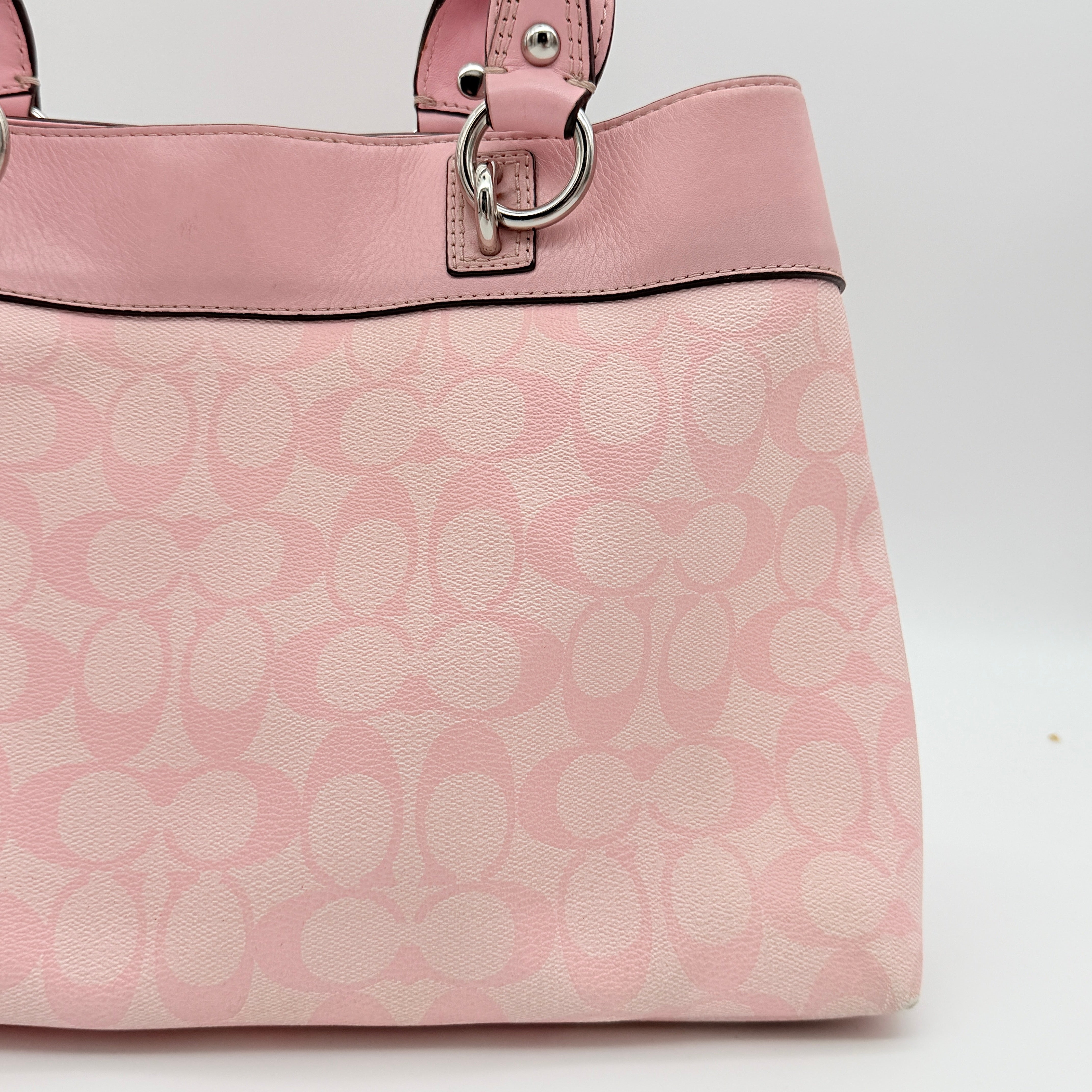 Coach Signature Penelope Shoulder Bag in pastel pink jacquard canvas with leather trim and silver-tone hardware.
