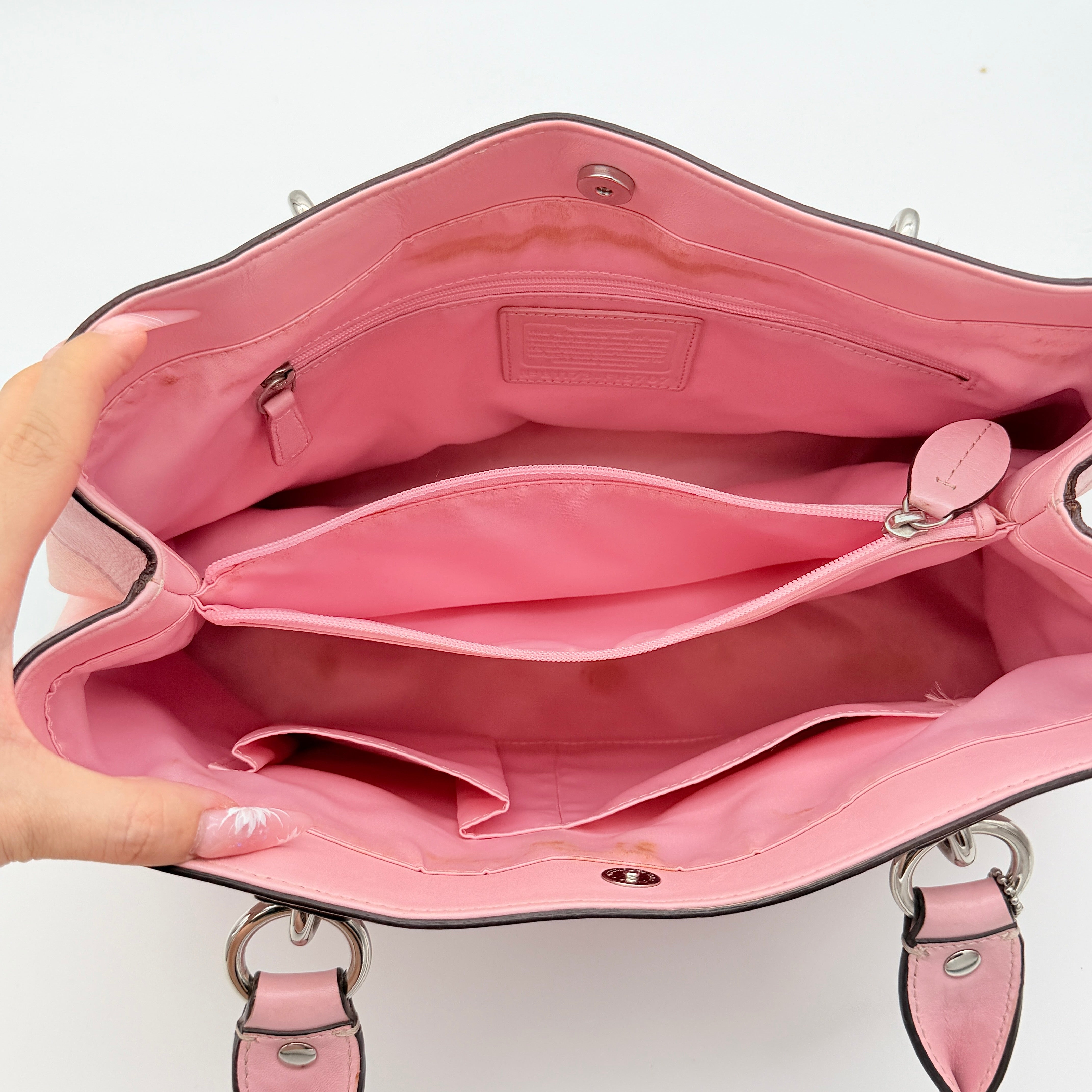 Coach Signature Penelope Shoulder Bag in pastel pink jacquard canvas with leather trim and silver-tone hardware.