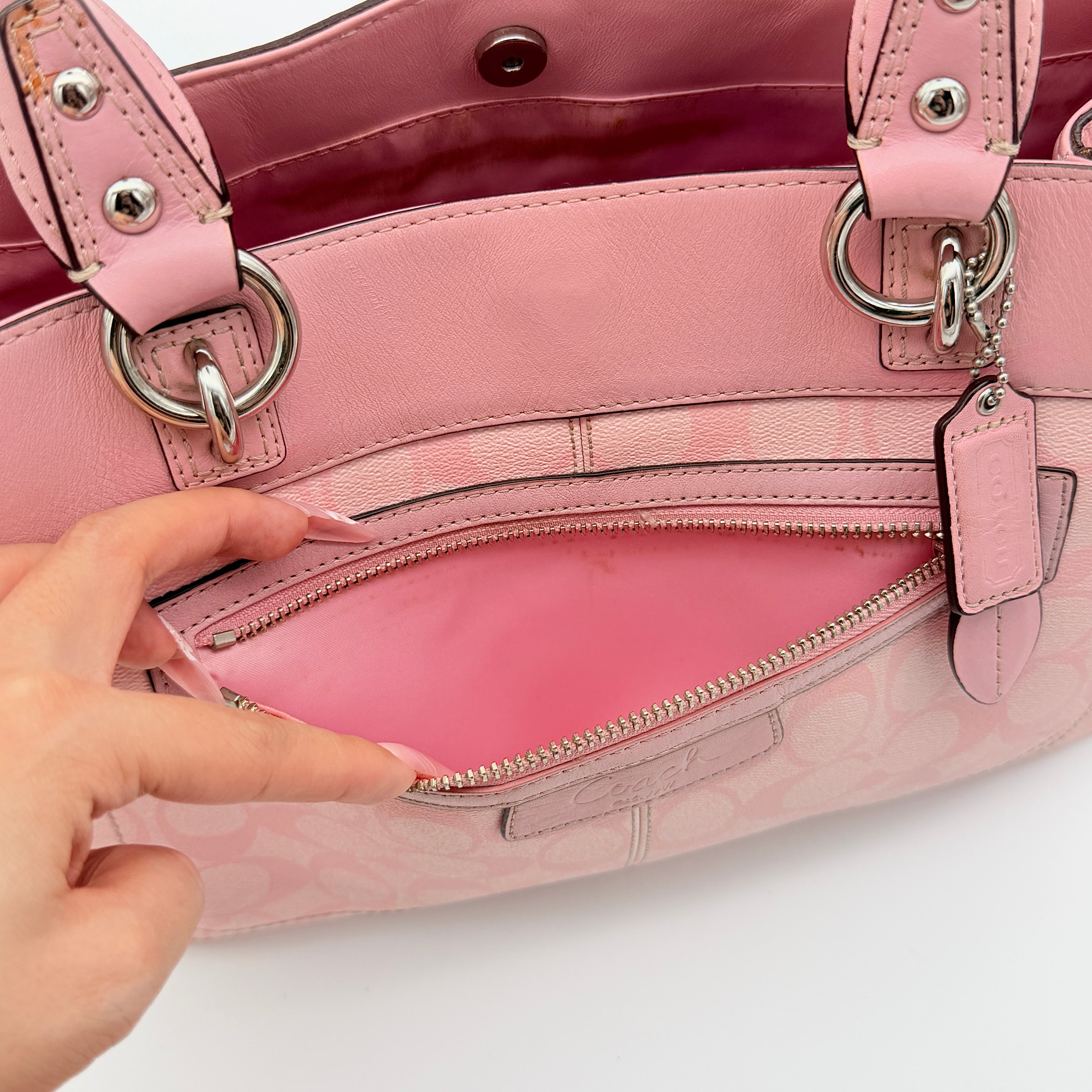 Coach Signature Penelope Shoulder Bag in pastel pink jacquard canvas with leather trim and silver-tone hardware.