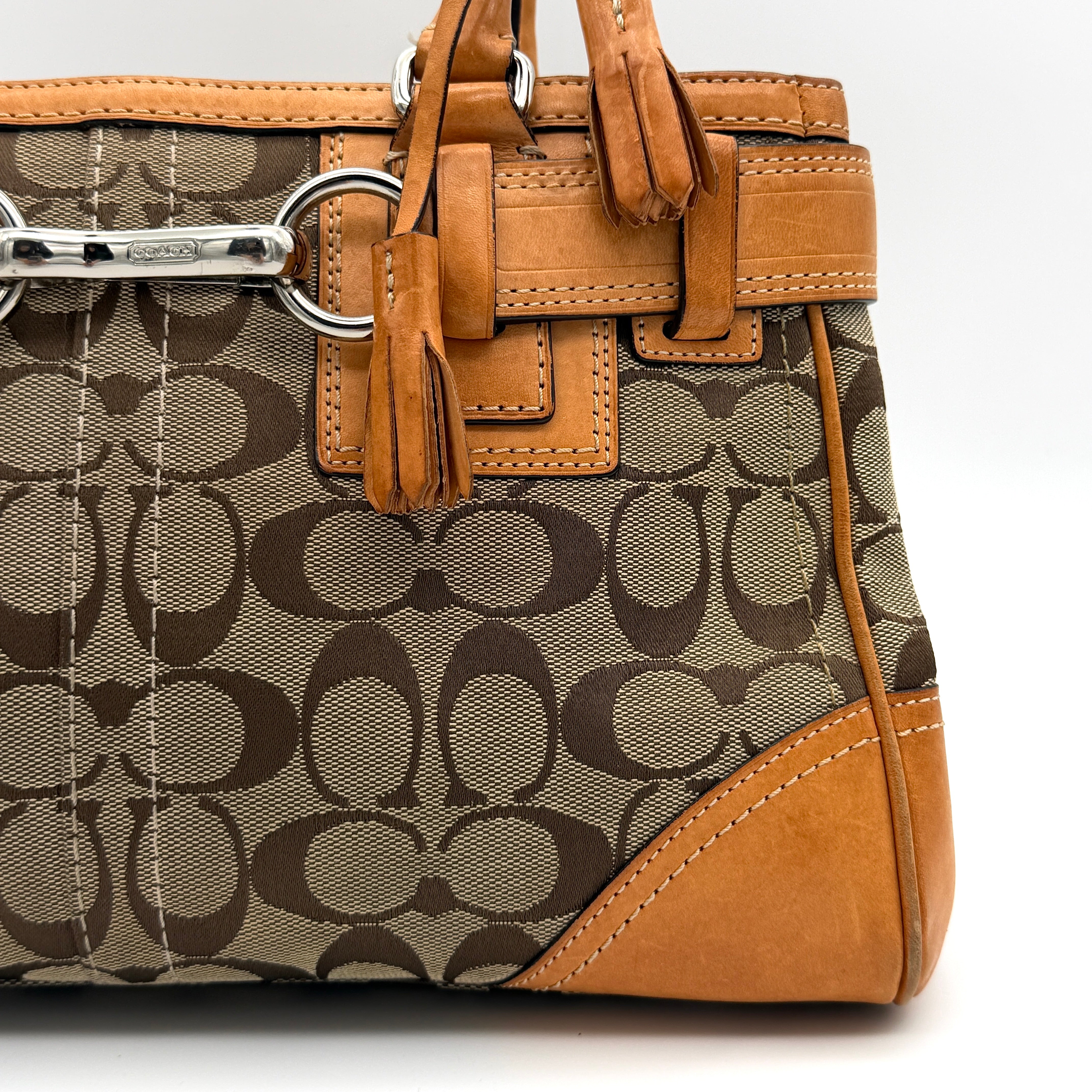 Coach Signature Hampton Carryall shoulder bag in beige monogram canvas and tan leather with silver-tone hardware and double handles.