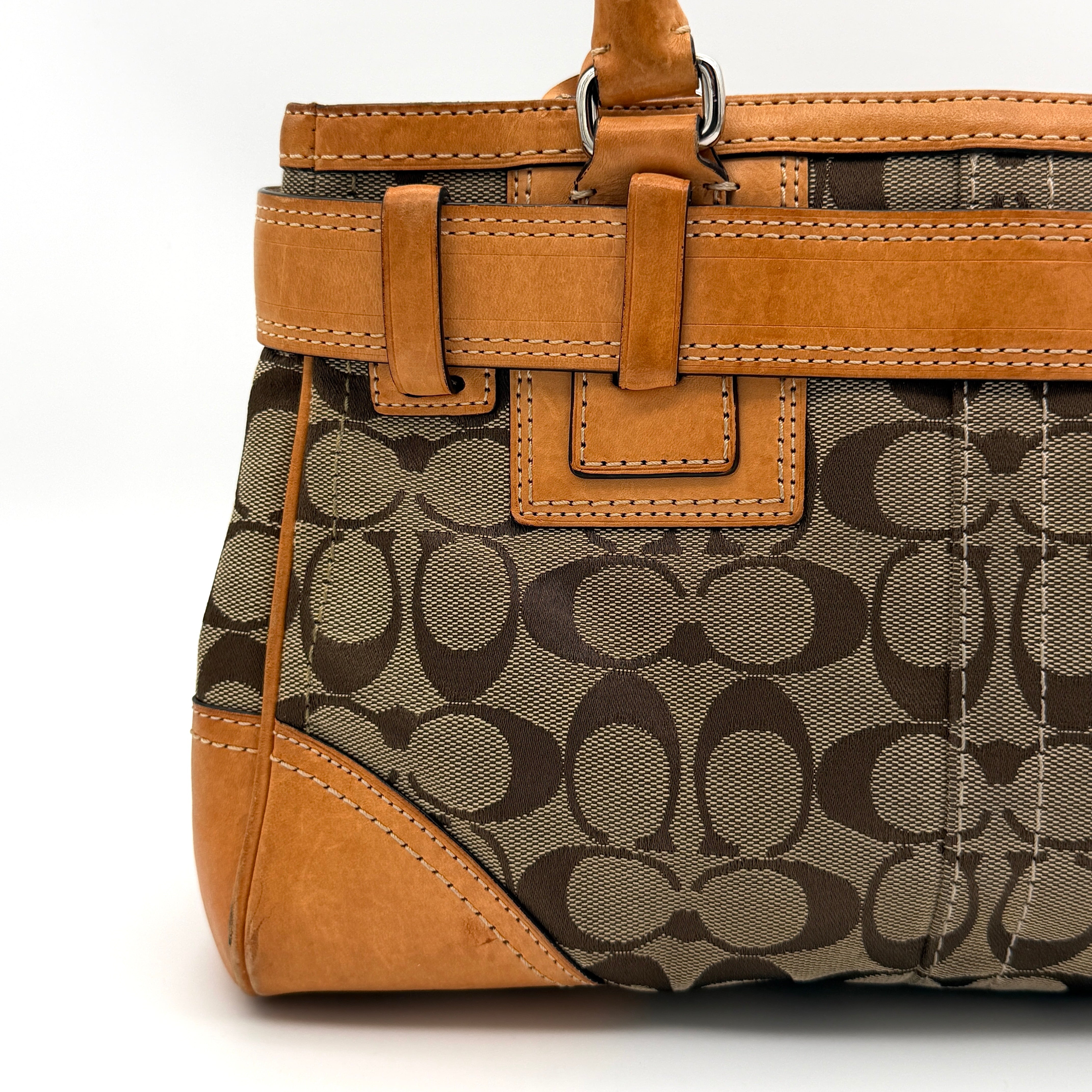 Coach Signature Hampton Carryall shoulder bag in beige monogram canvas and tan leather with silver-tone hardware and double handles.
