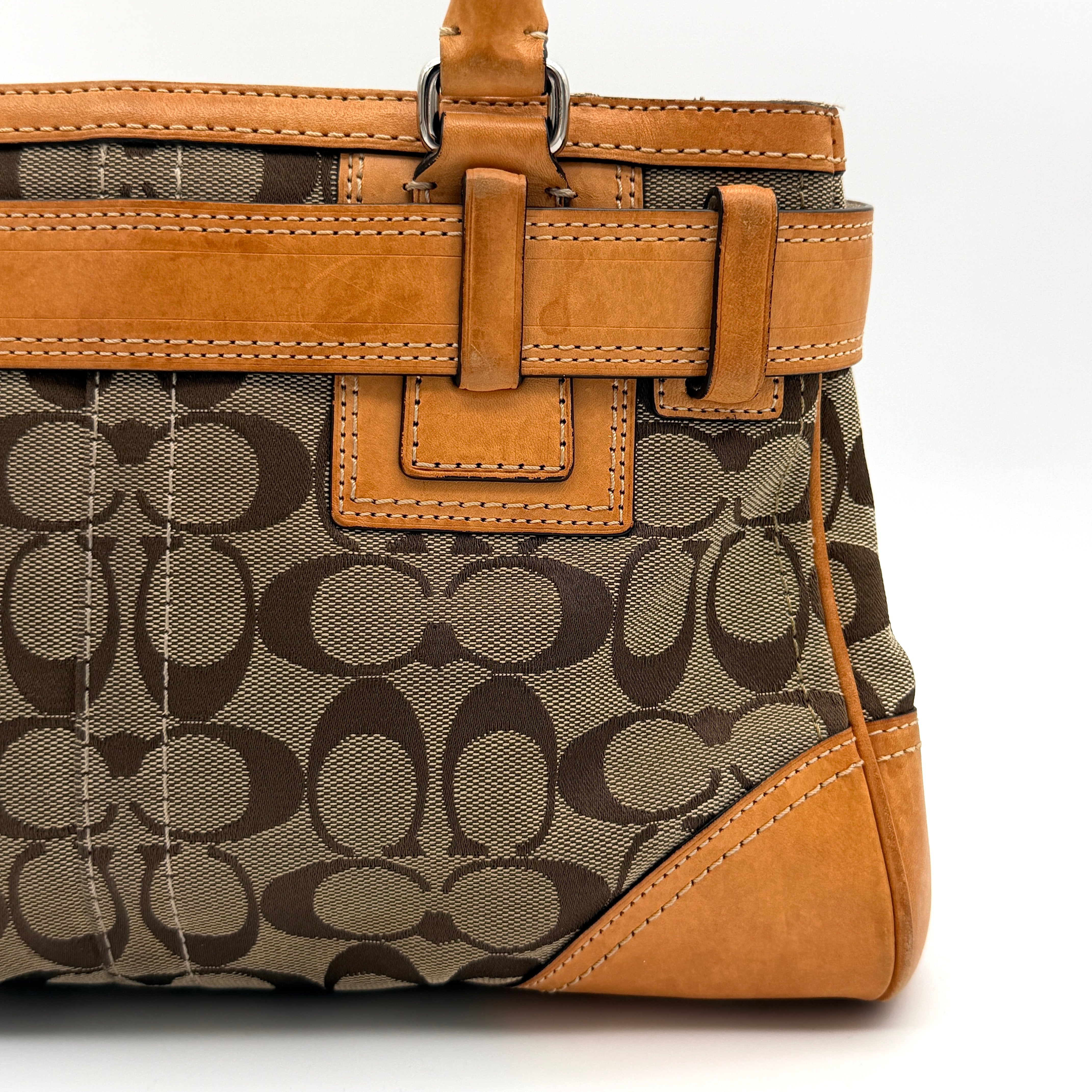 Coach Signature Hampton Carryall shoulder bag in beige monogram canvas and tan leather with silver-tone hardware and double handles.