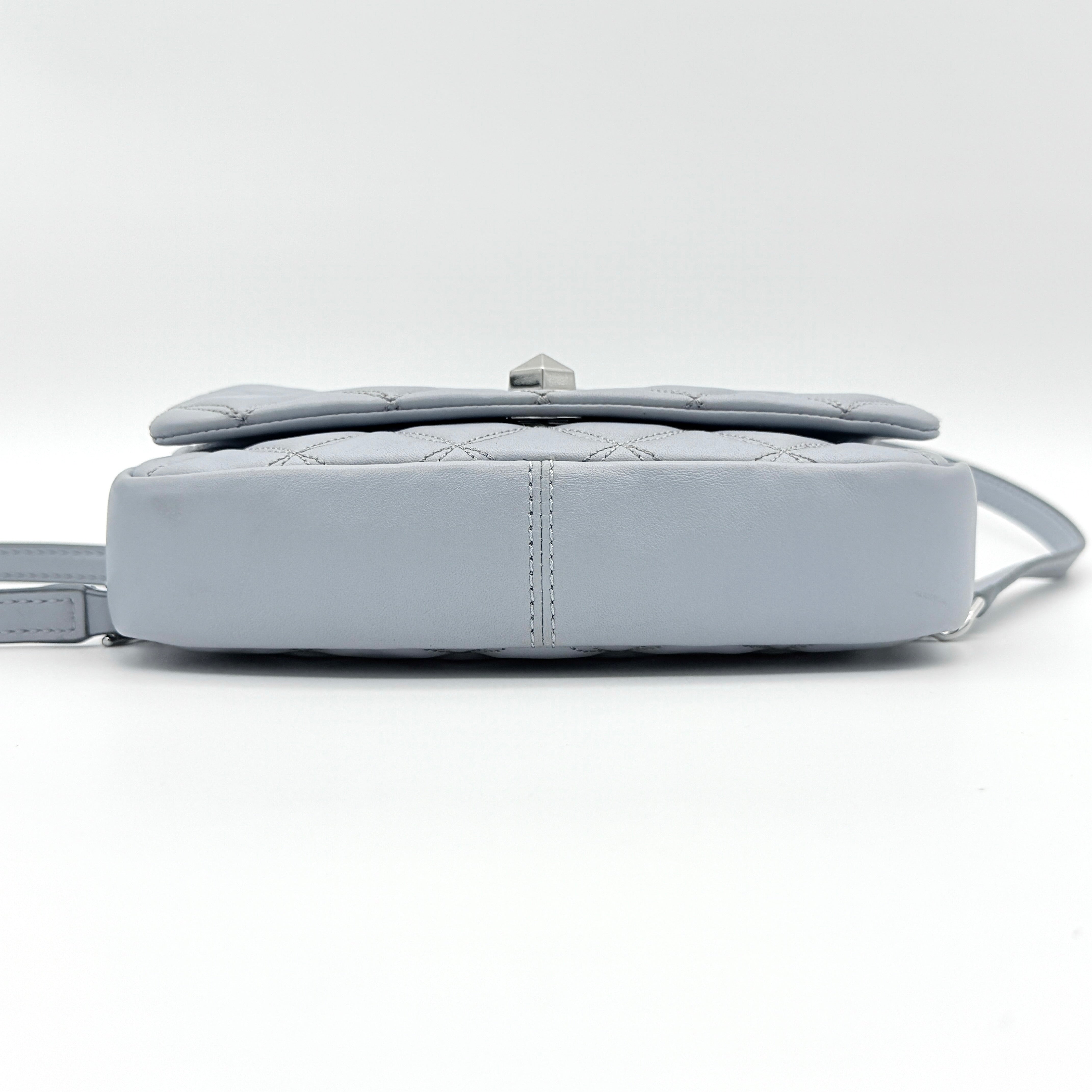 Kate Spade Natalia Flap Crossbody in light blue quilted leather with a silver chain and turn-lock detail.
