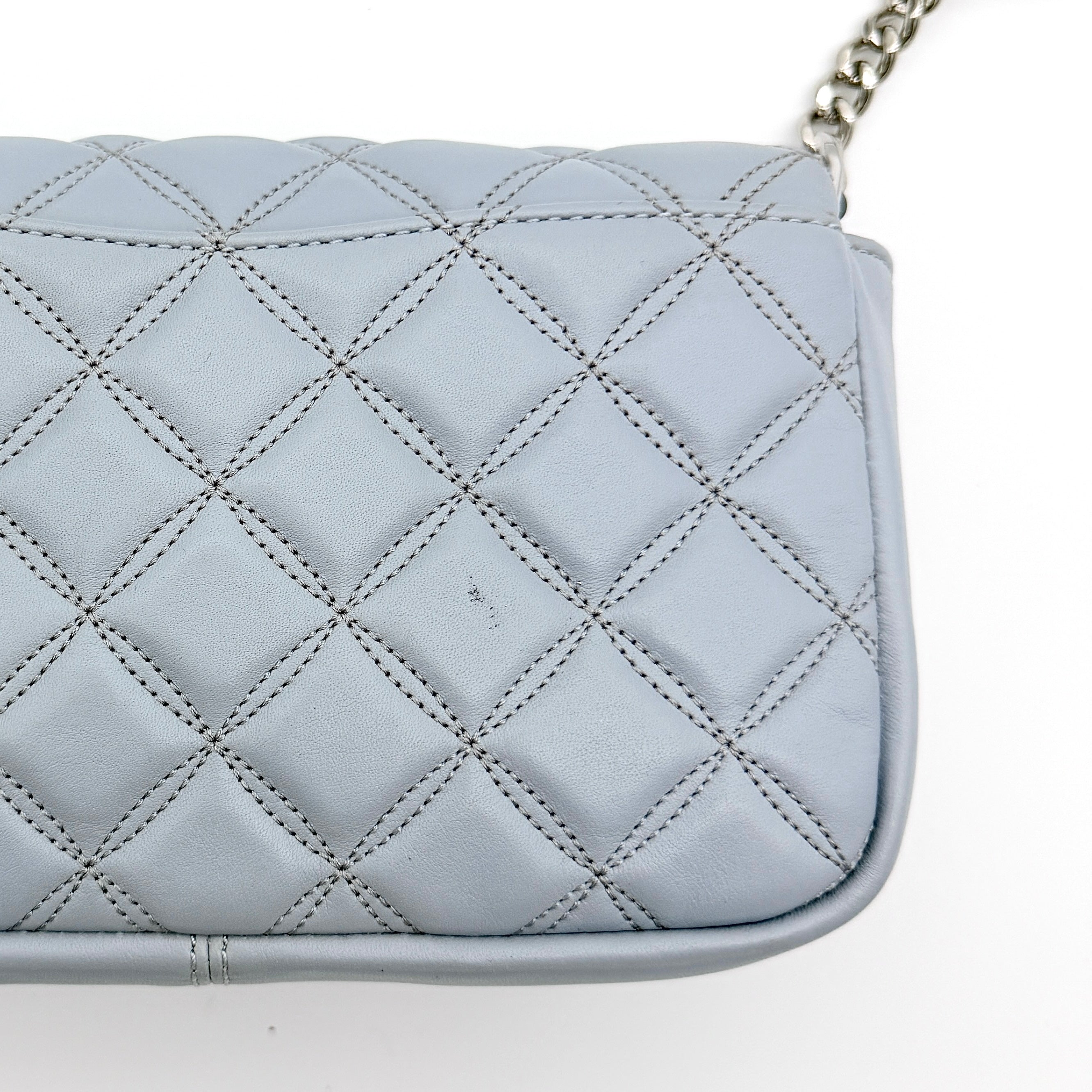Kate Spade Natalia Flap Crossbody in light blue quilted leather with a silver chain and turn-lock detail.