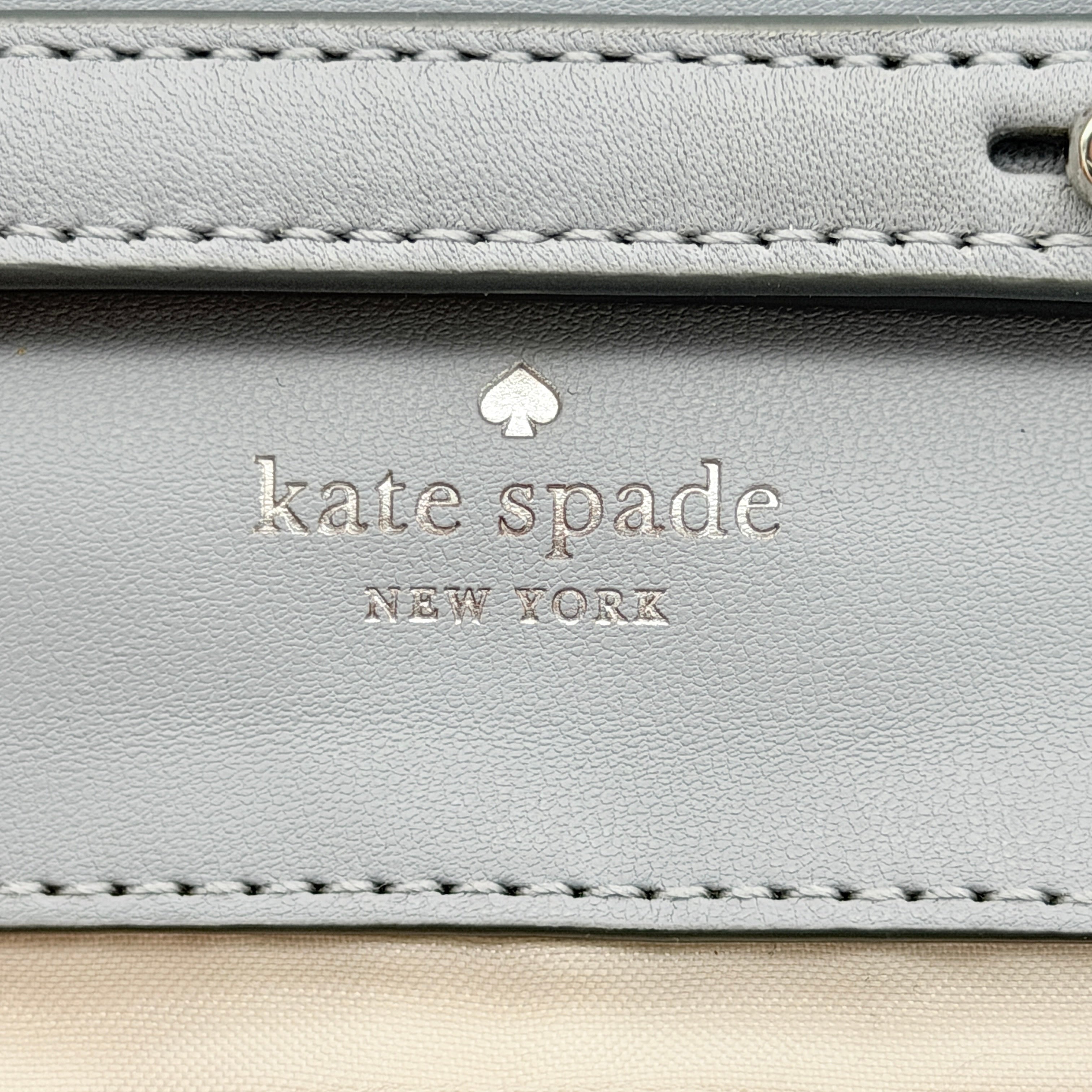 Kate Spade Natalia Flap Crossbody in light blue quilted leather with a silver chain and turn-lock detail.