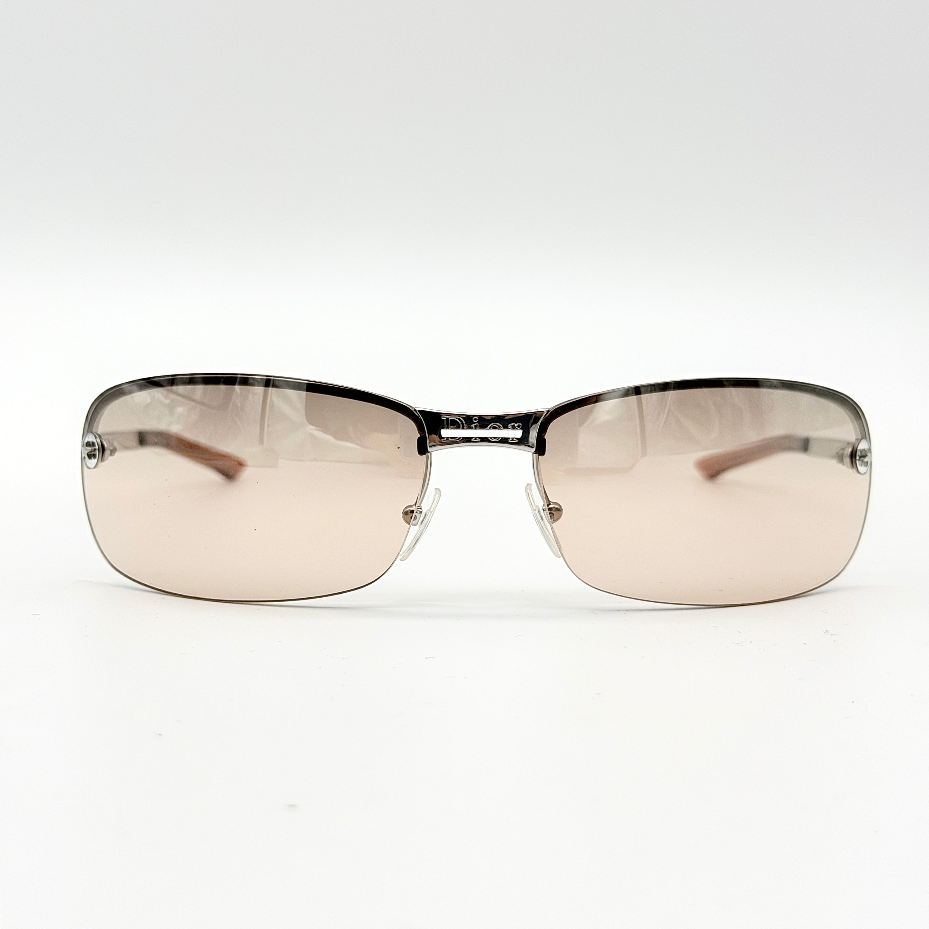 Dior Adiorable 3/L sunglasses in silver with brown gradient lenses, displayed in front of the Dior hard case.