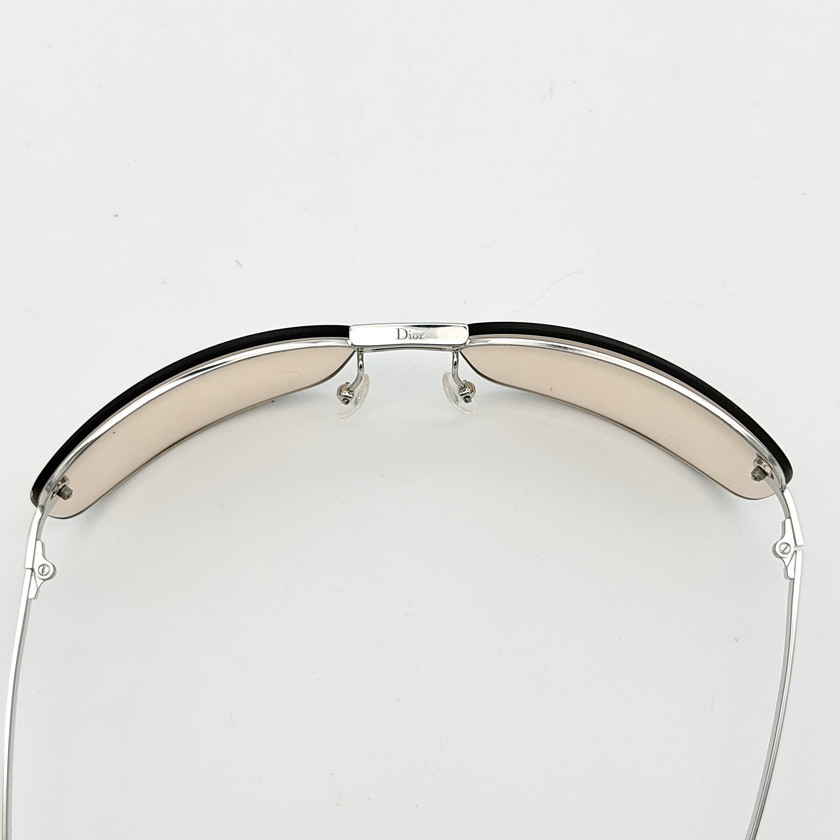 Dior Adiorable 3/L sunglasses in silver with brown gradient lenses, displayed in front of the Dior hard case.