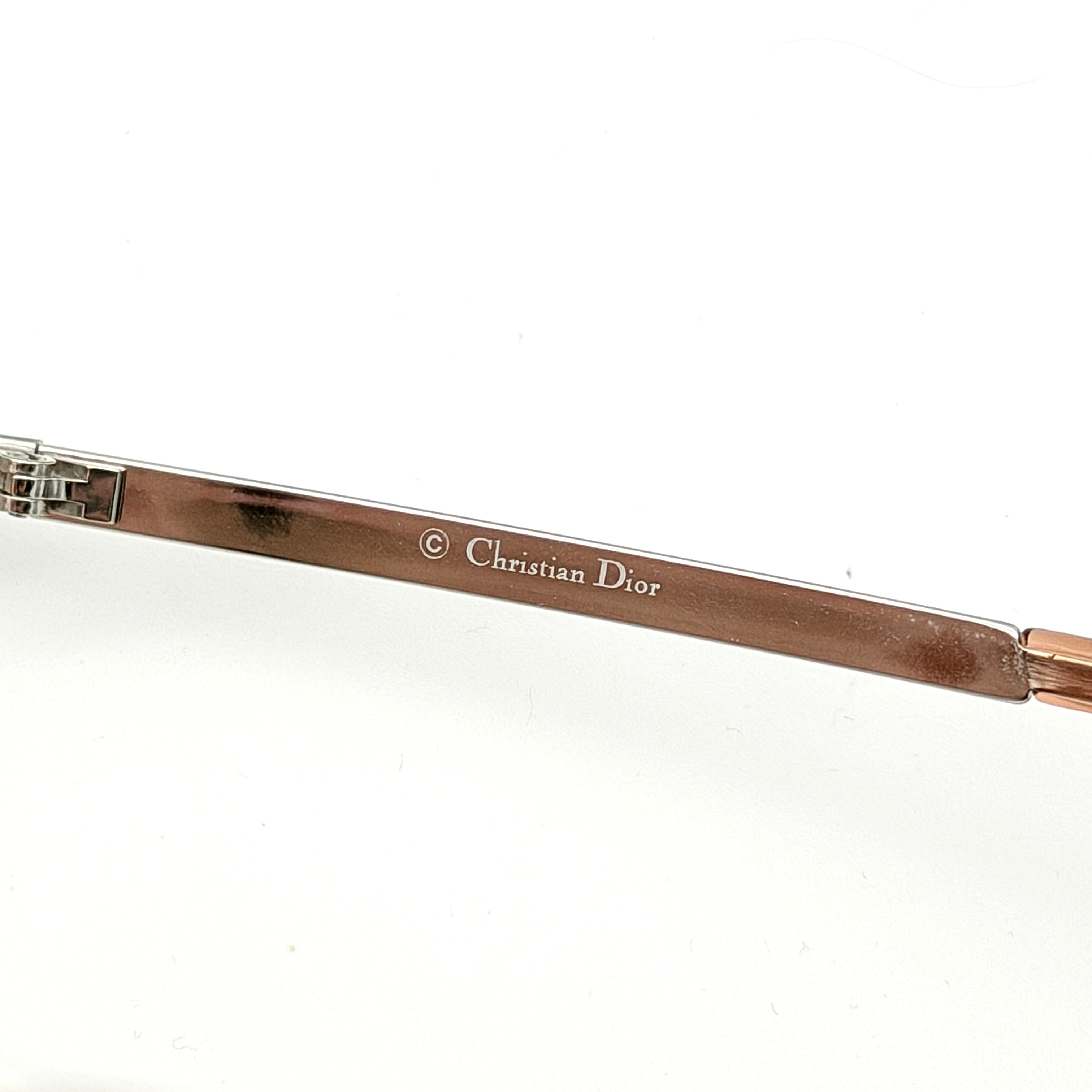 Dior Adiorable 3/L sunglasses in silver with brown gradient lenses, displayed in front of the Dior hard case.