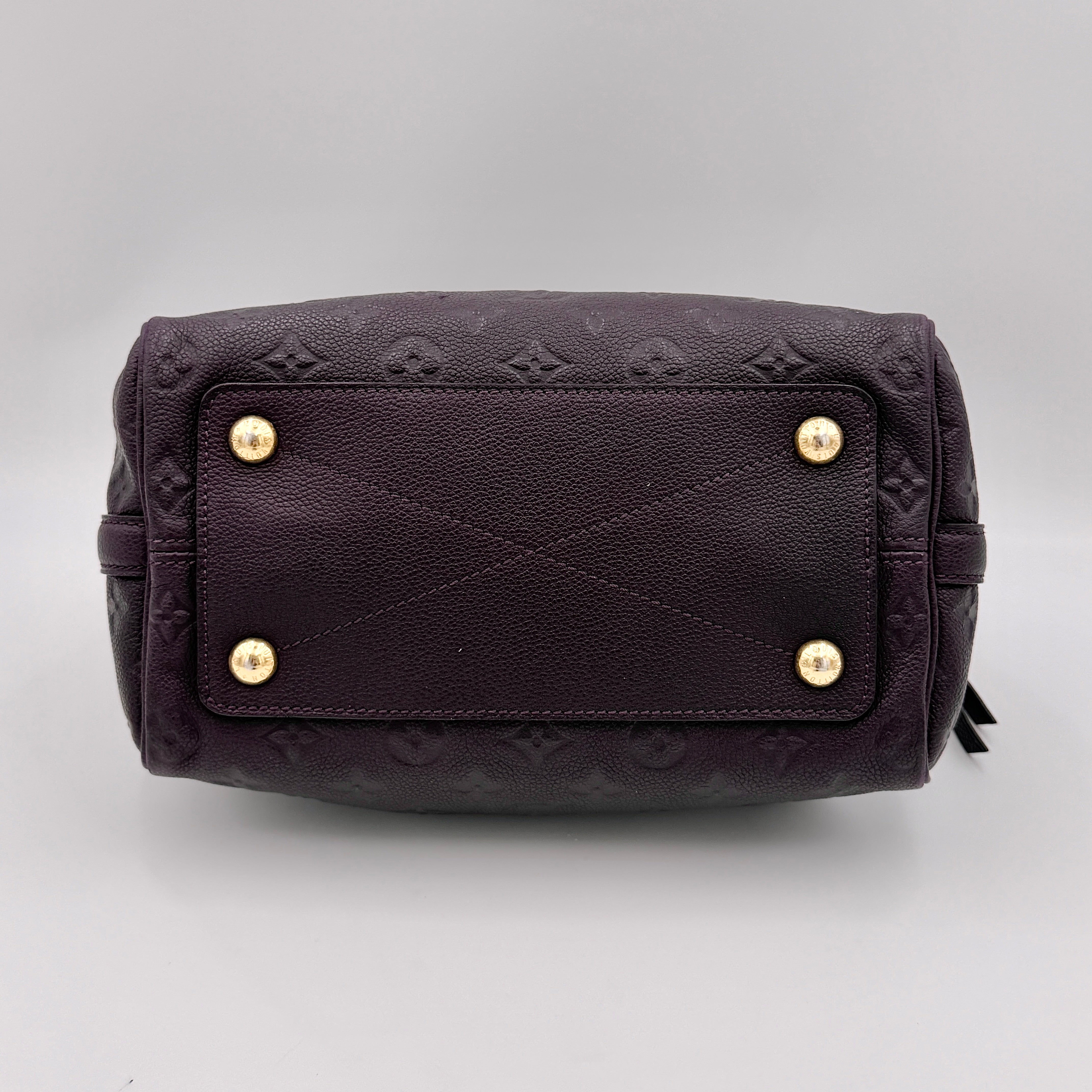 Louis Vuitton 2Way Monogram Empreinte Speedy Bandoulière 25 in deep purple grained leather with gold-tone hardware and detachable strap.