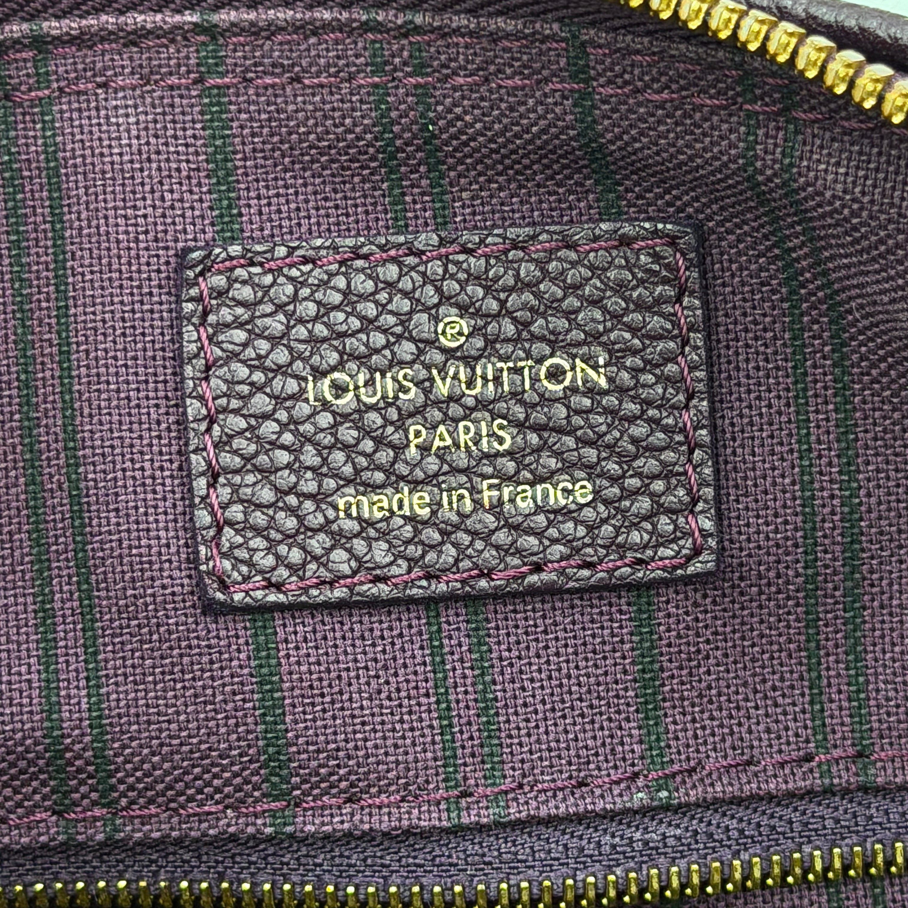 Louis Vuitton 2Way Monogram Empreinte Speedy Bandoulière 25 in deep purple grained leather with gold-tone hardware and detachable strap.