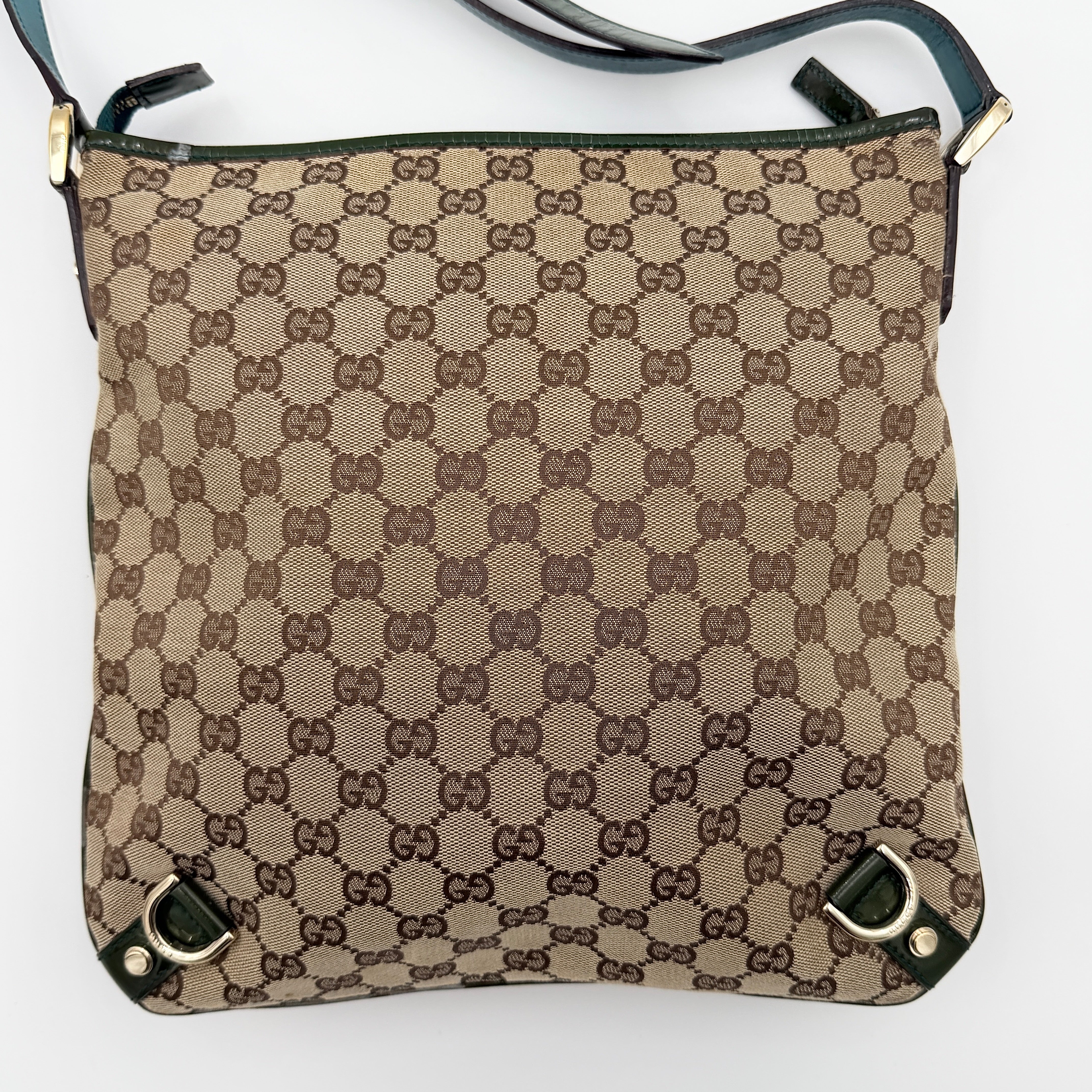 Gucci GG Monogram Abbey D Ring Crossbody Bag in beige canvas with green leather trim and gold-tone hardware, featuring an adjustable green strap.
