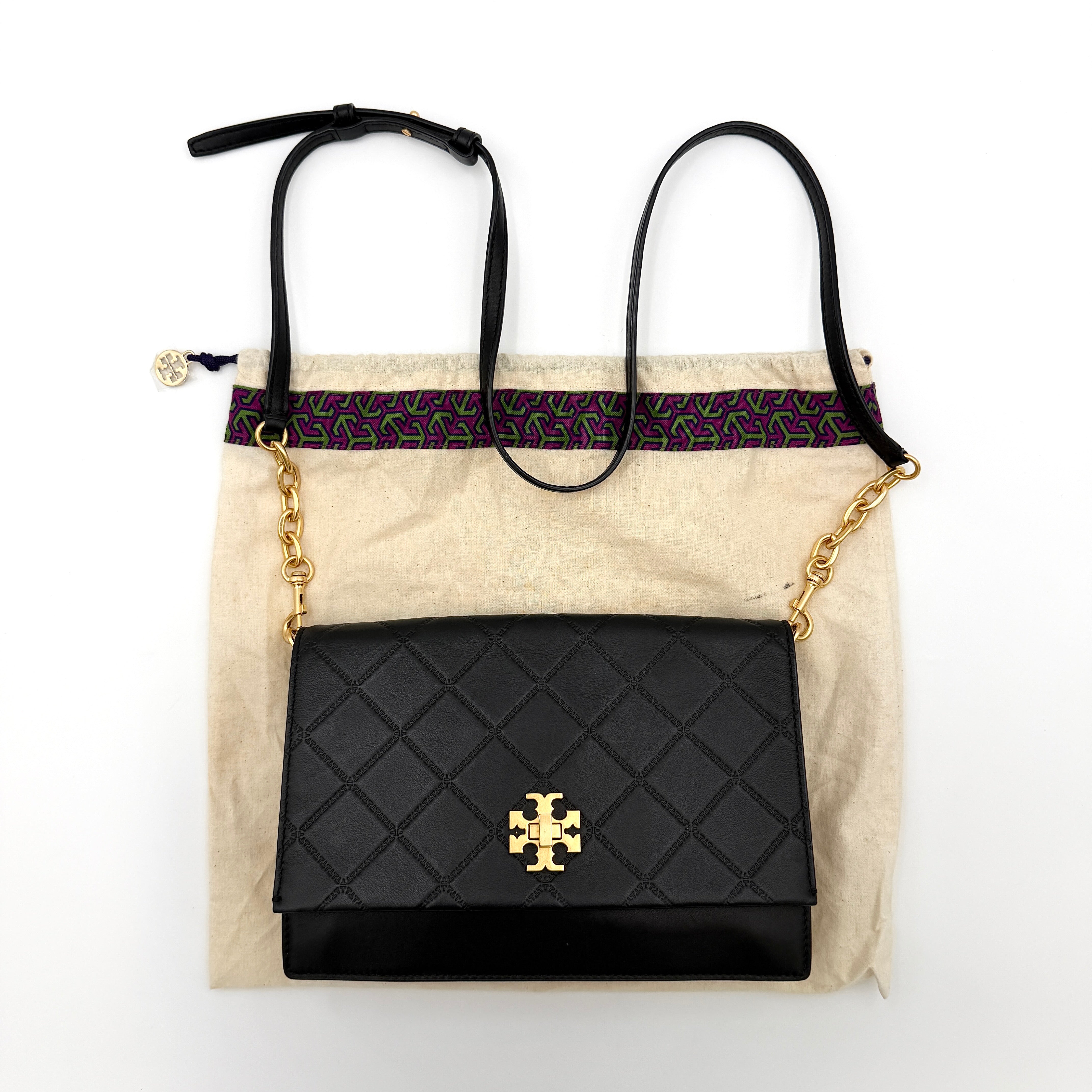 Tory Burch Georgia crossbody in black quilted leather with gold hardware, styled with adjustable chain and leather strap.