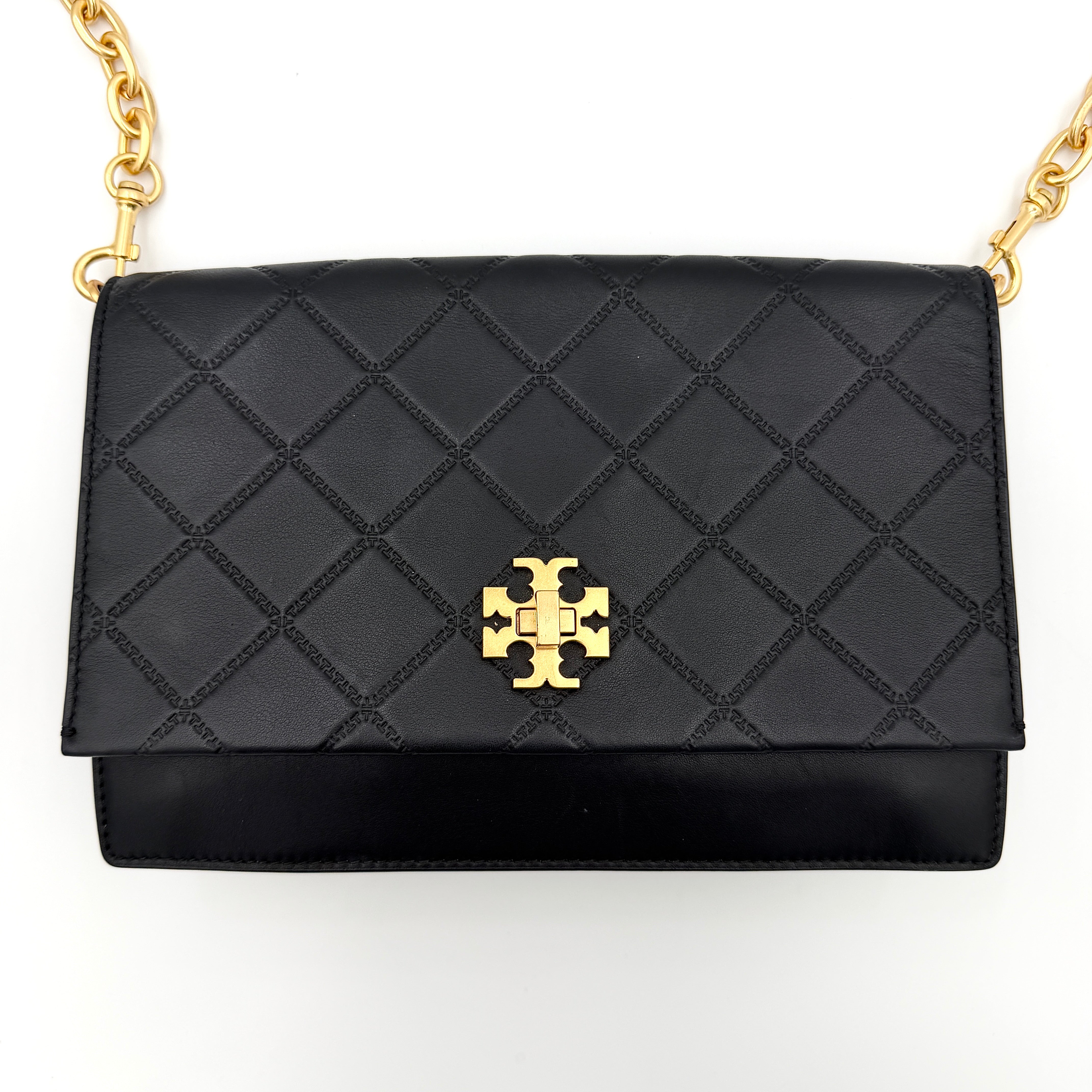 Tory Burch Georgia crossbody in black quilted leather with gold hardware, styled with adjustable chain and leather strap.