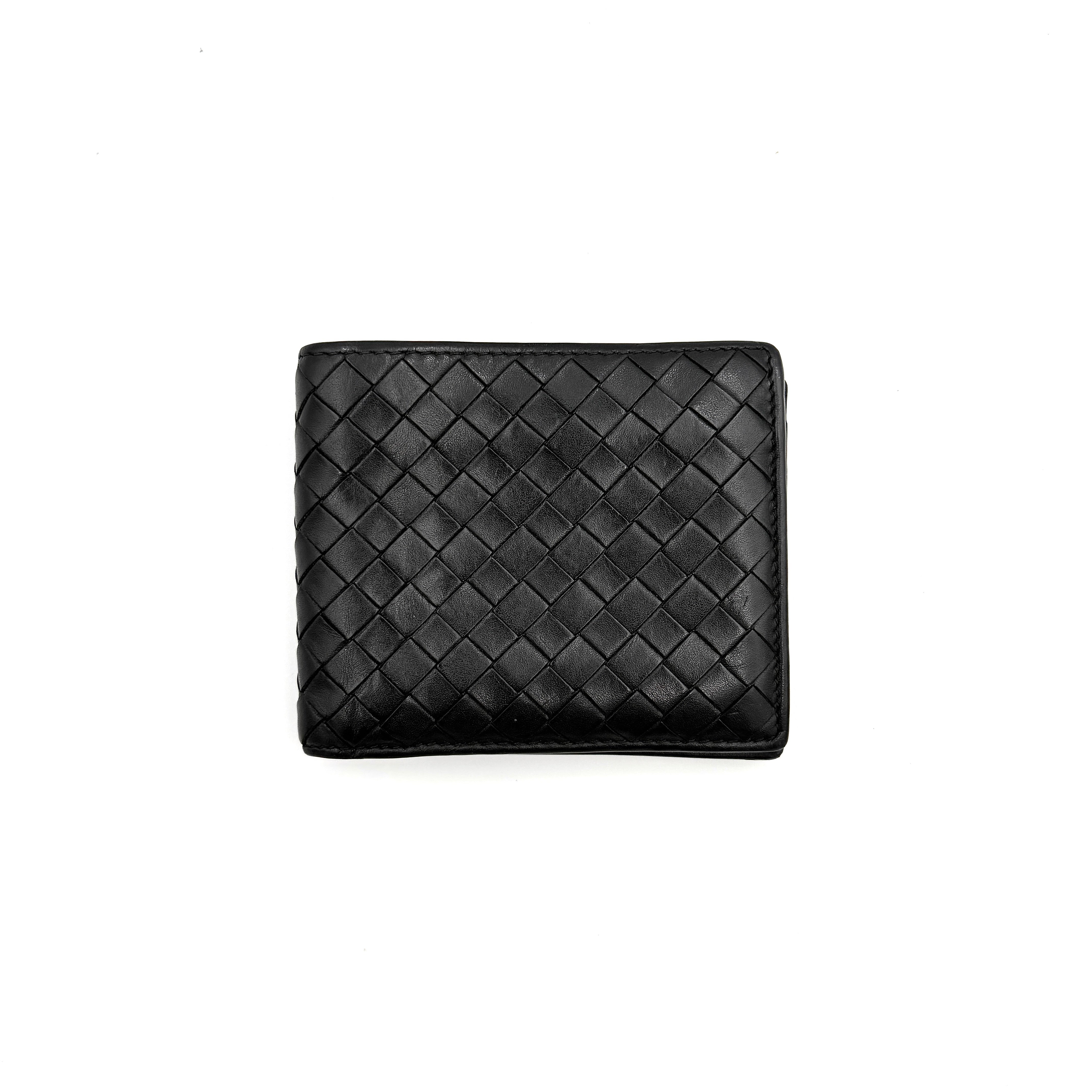 Bottega Veneta black intrecciato leather wallet shown against a plain background highlighting its woven texture.