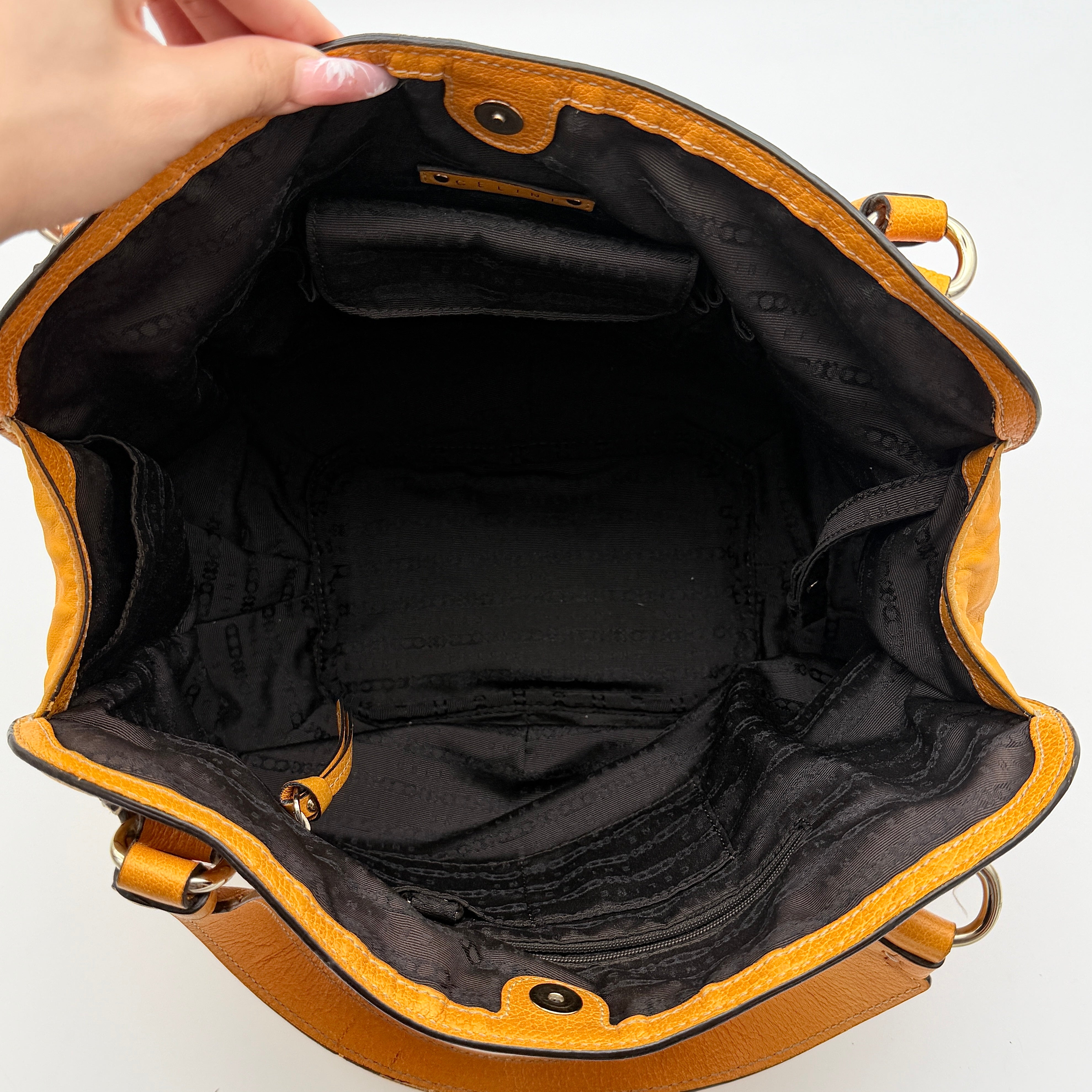 Celine Stripe Hobo Shoulder Bag in yellow leather with vertical stitching and signature gold-tone medallion, shown with dual handles.