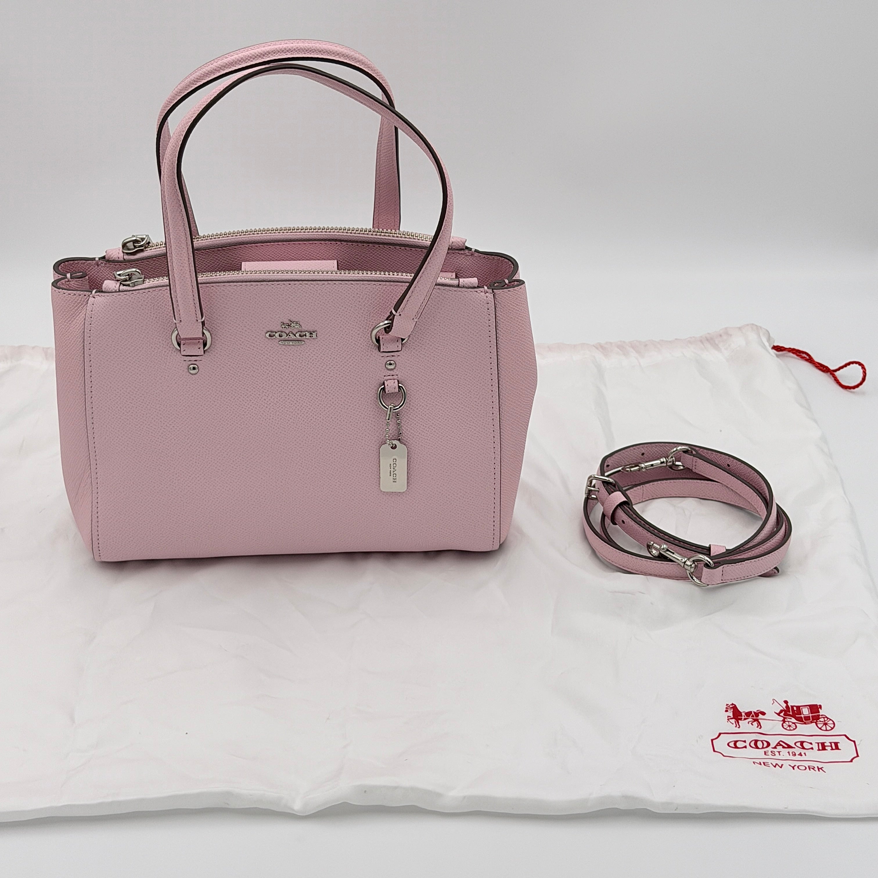 Coach Stanton 26 Carryall in blush pink grained leather with dual handles, silver hardware, and detachable strap.
