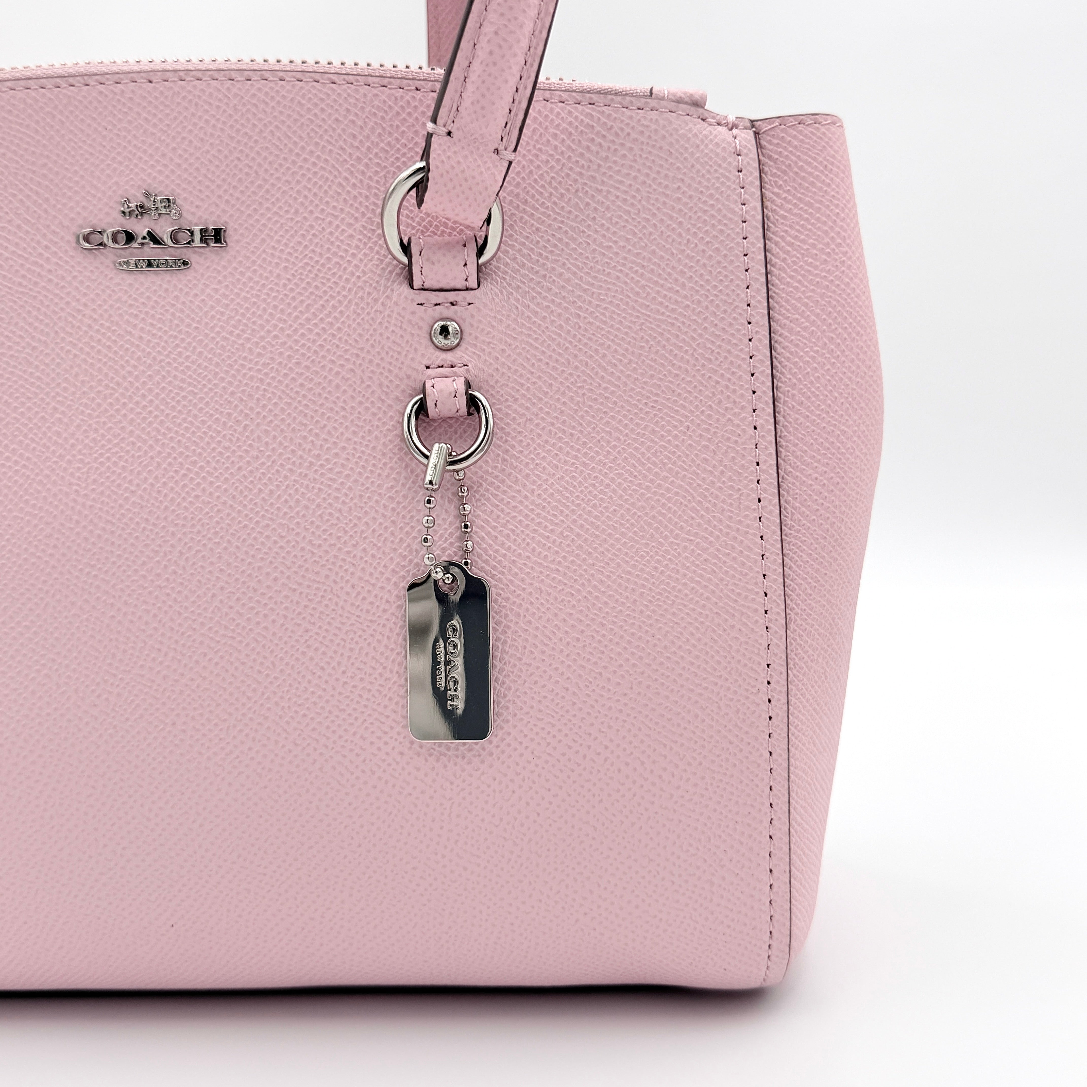Coach Stanton 26 Carryall in blush pink grained leather with dual handles, silver hardware, and detachable strap.