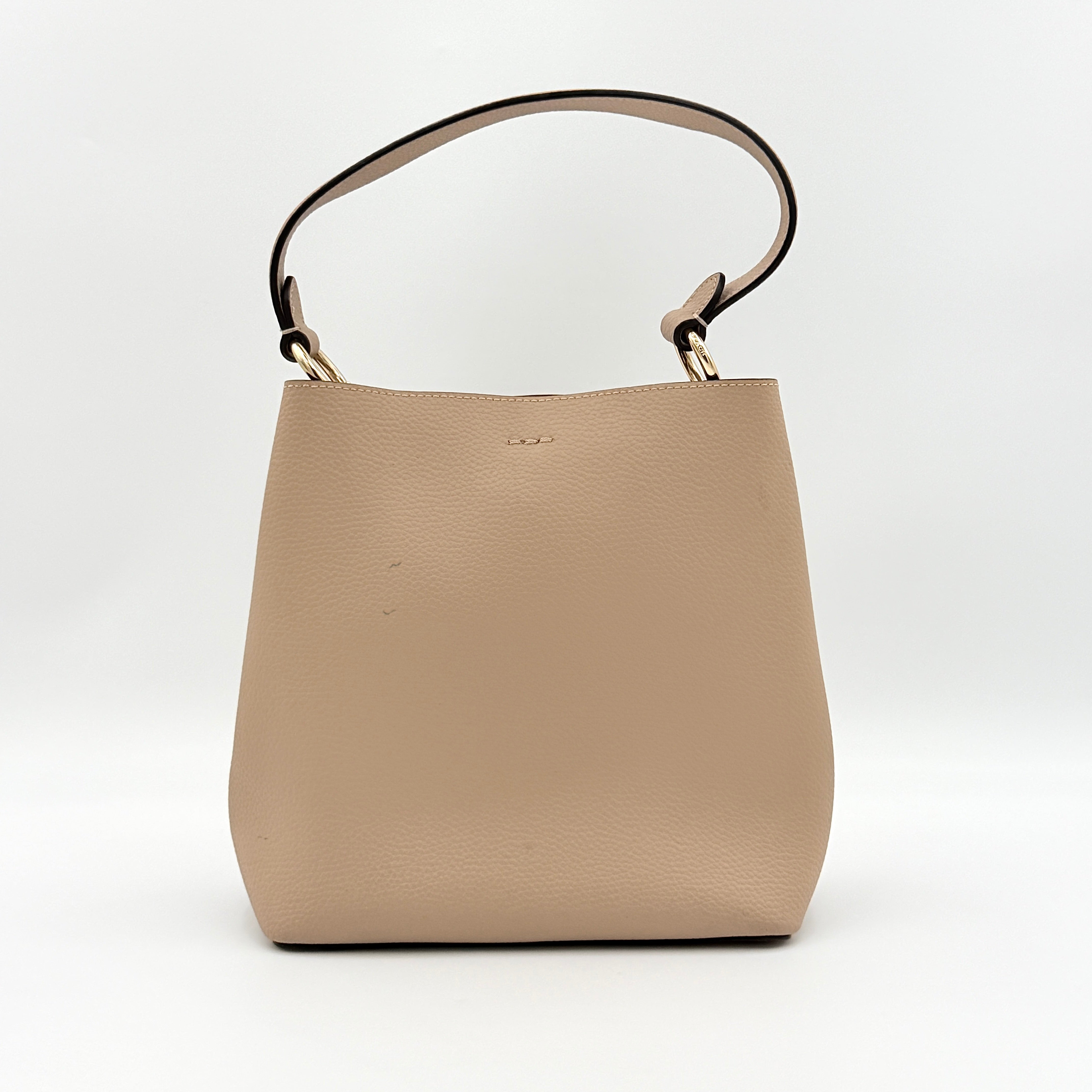 Coach Town Bucket Bag in taupe pebbled leather with gold-tone hardware and Coach hangtag, shown against a white background.