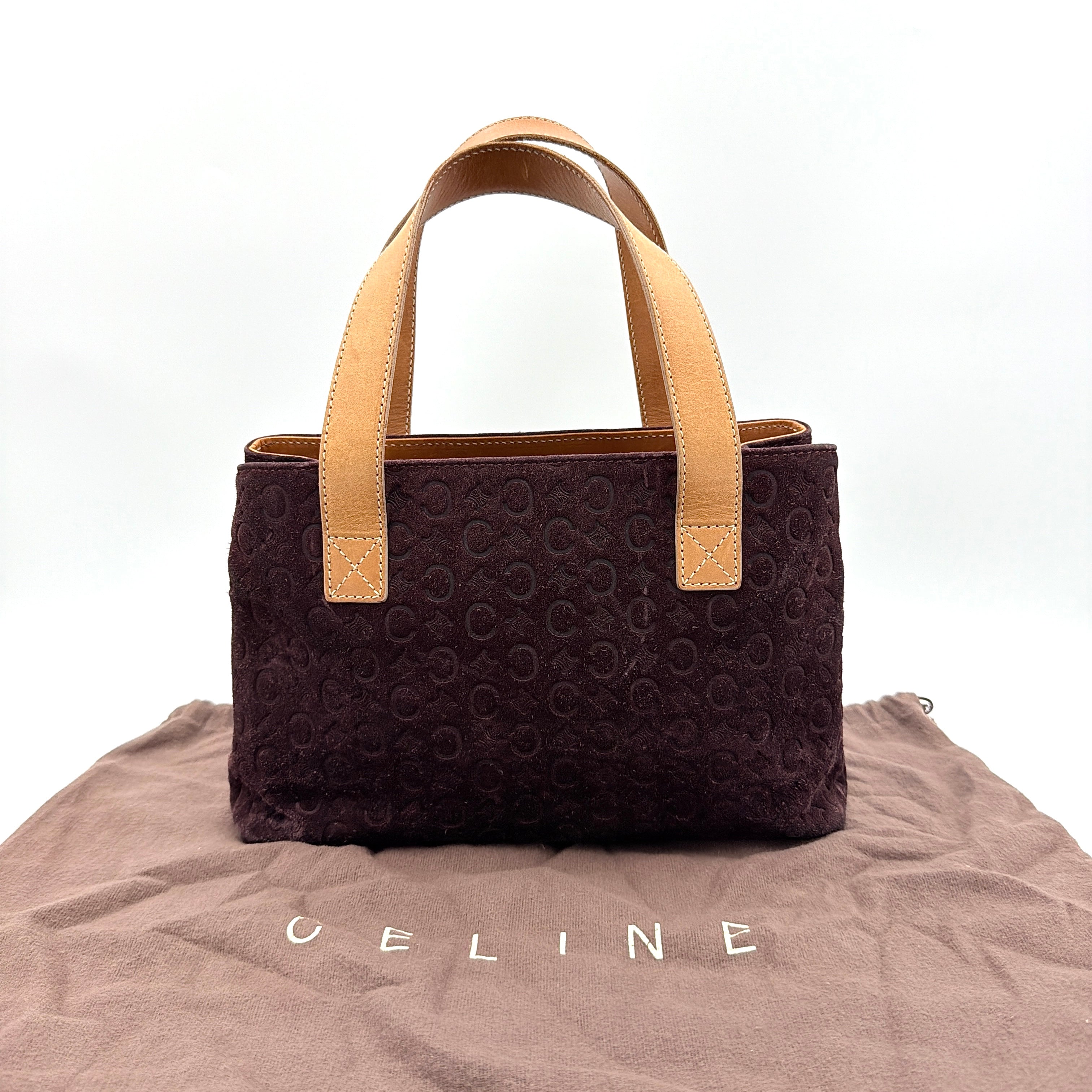 Celine C Macadam Shoulder Bag in rich brown embossed suede with tan leather handles, showcased against a plain background.