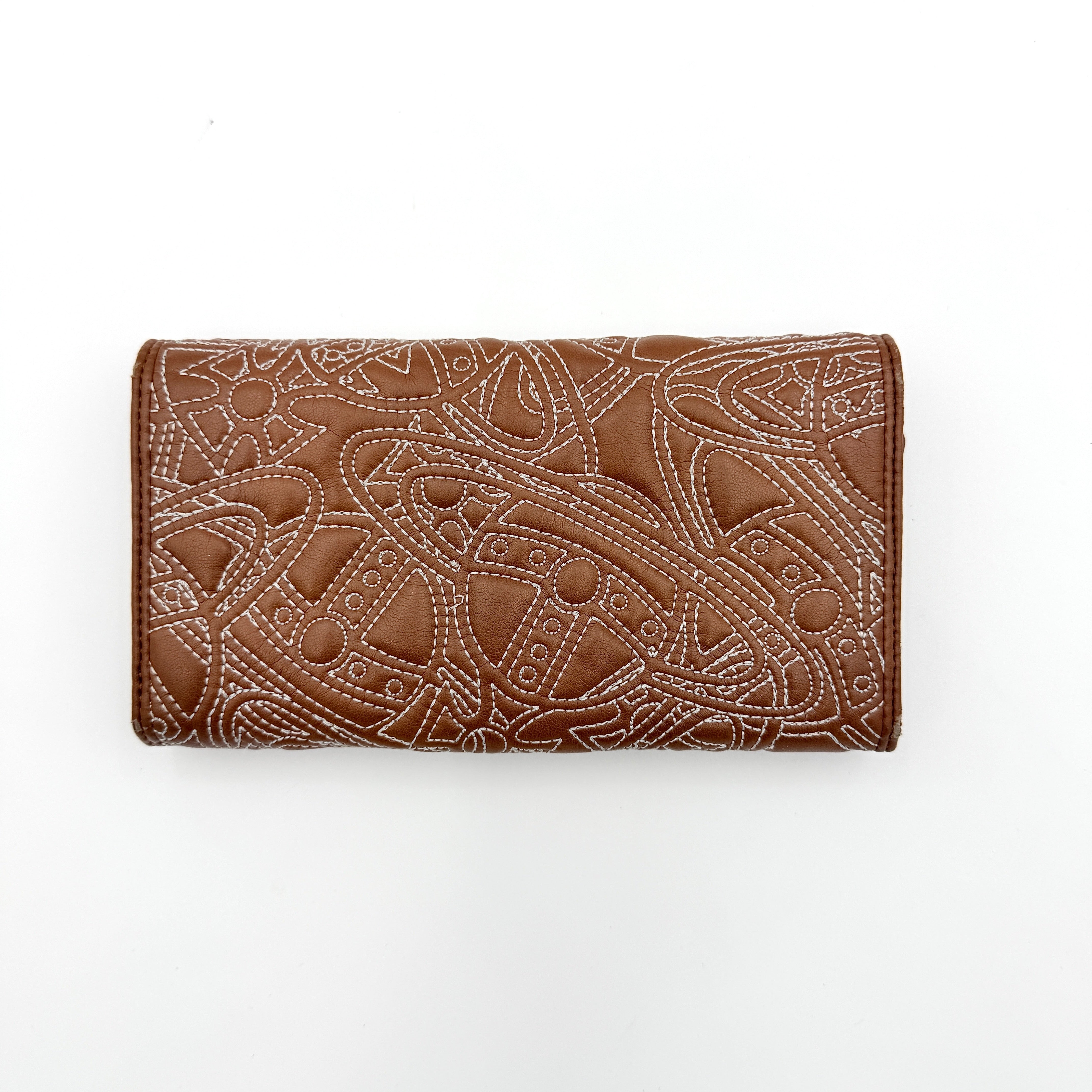 Vivienne Westwood long wallet in chestnut brown leather with white contrast stitching and silver orb embellishment.