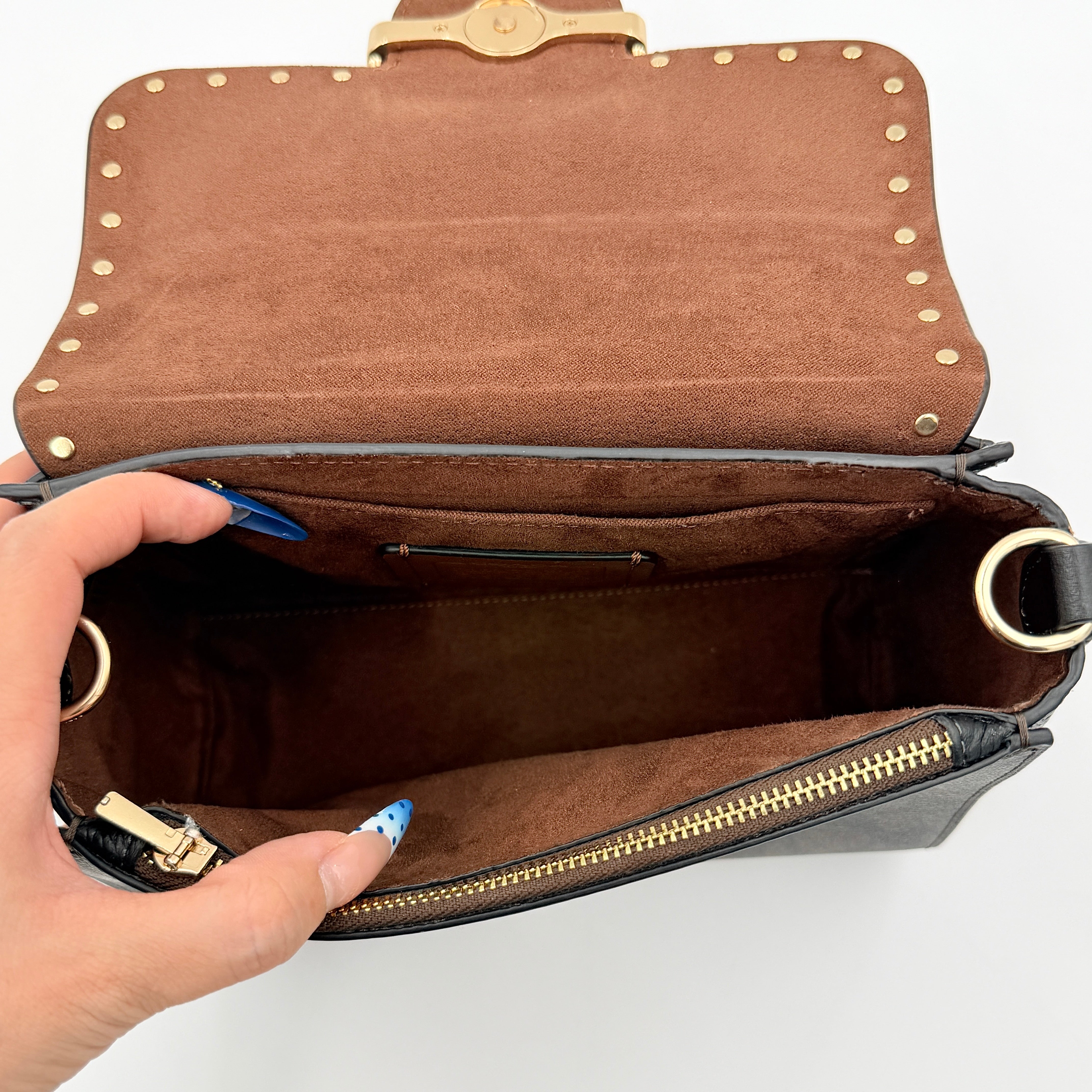 Coach Morgan Top Handle Bag in brown and black signature canvas with pebbled leather, gold hardware and detachable strap displayed alongside a Coach dustbag.