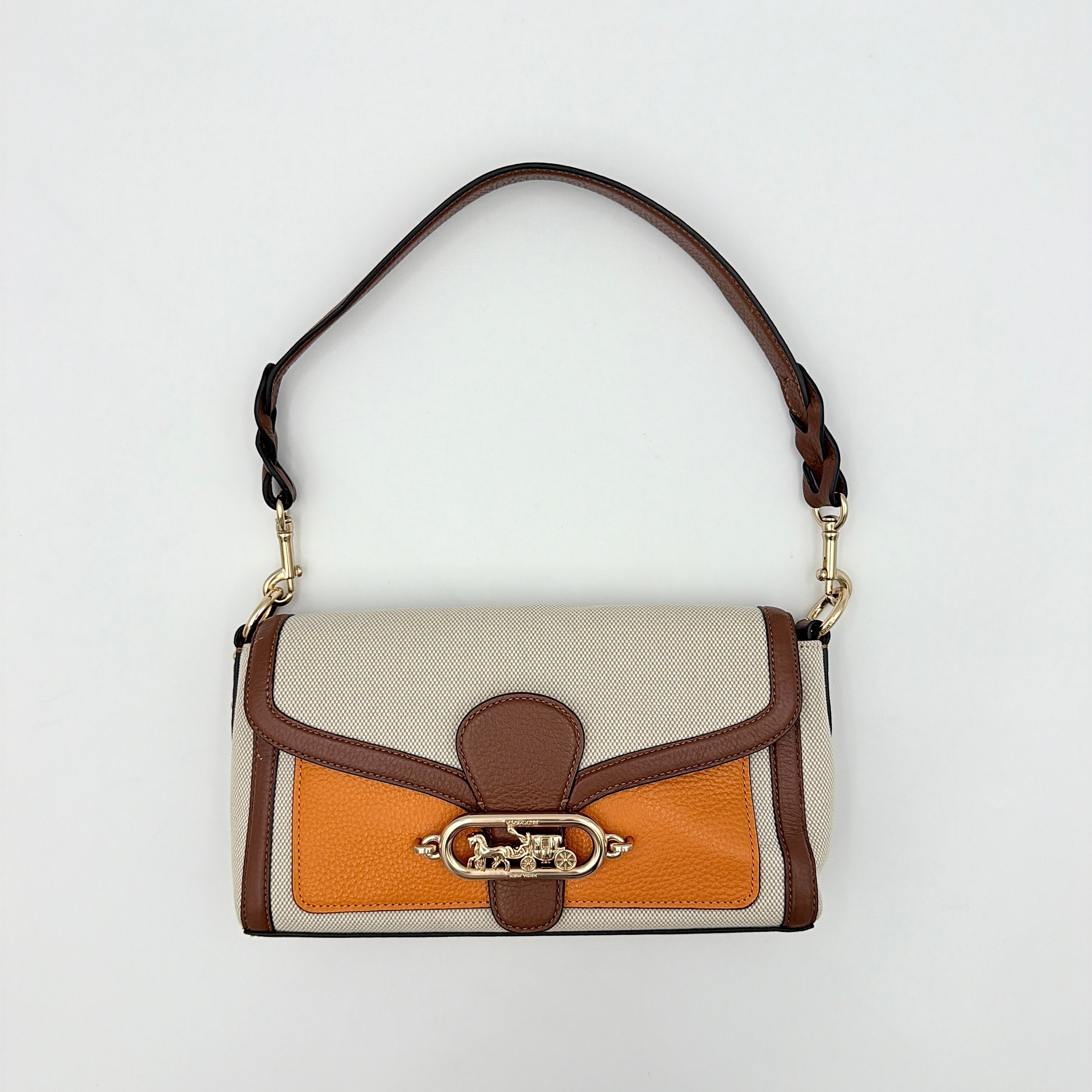 Coach Jade 2Way Shoulder Bag in sand canvas with amber and brown leather trim, gold-tone carriage hardware, and detachable strap.