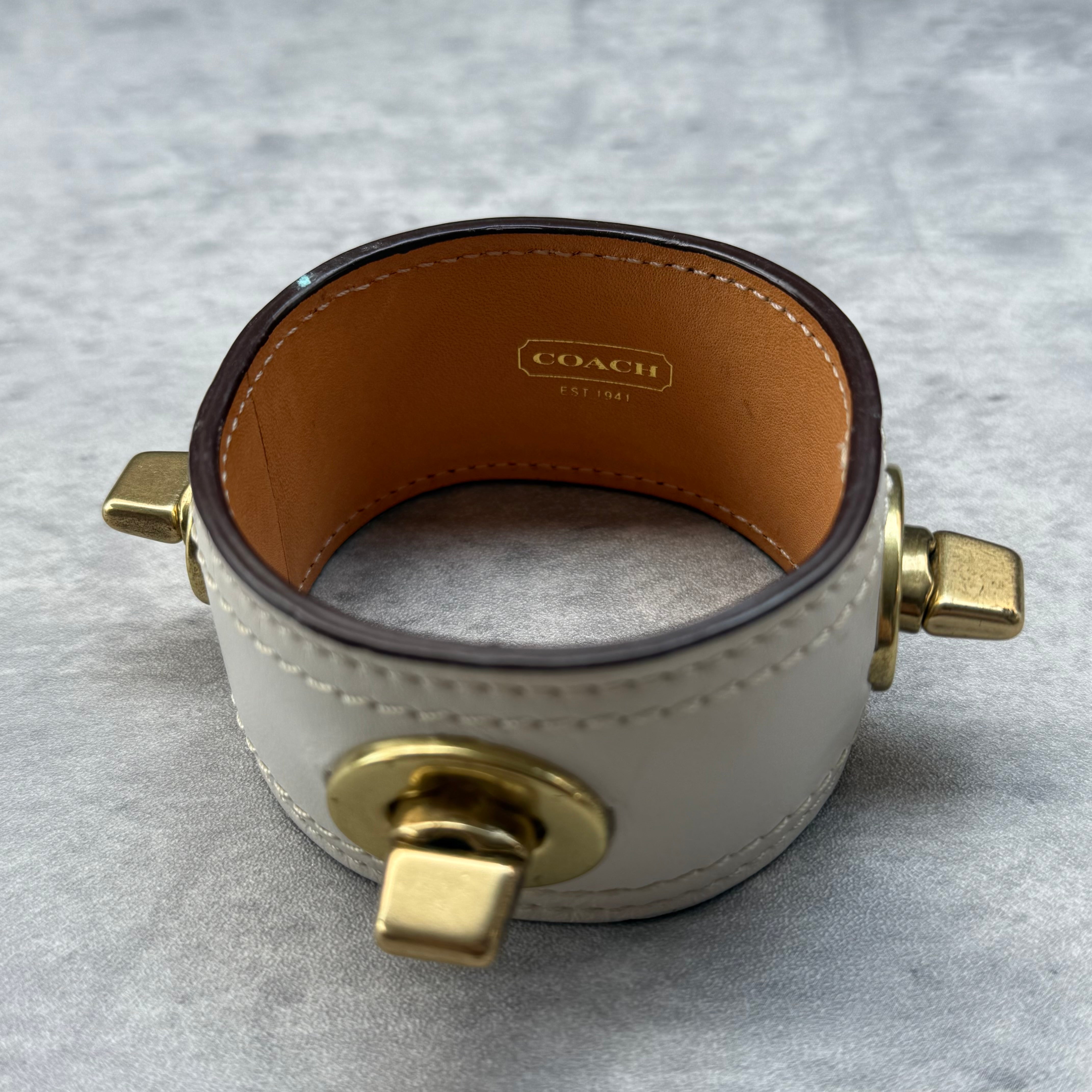 Coach Turnlock Cuff Bracelet White