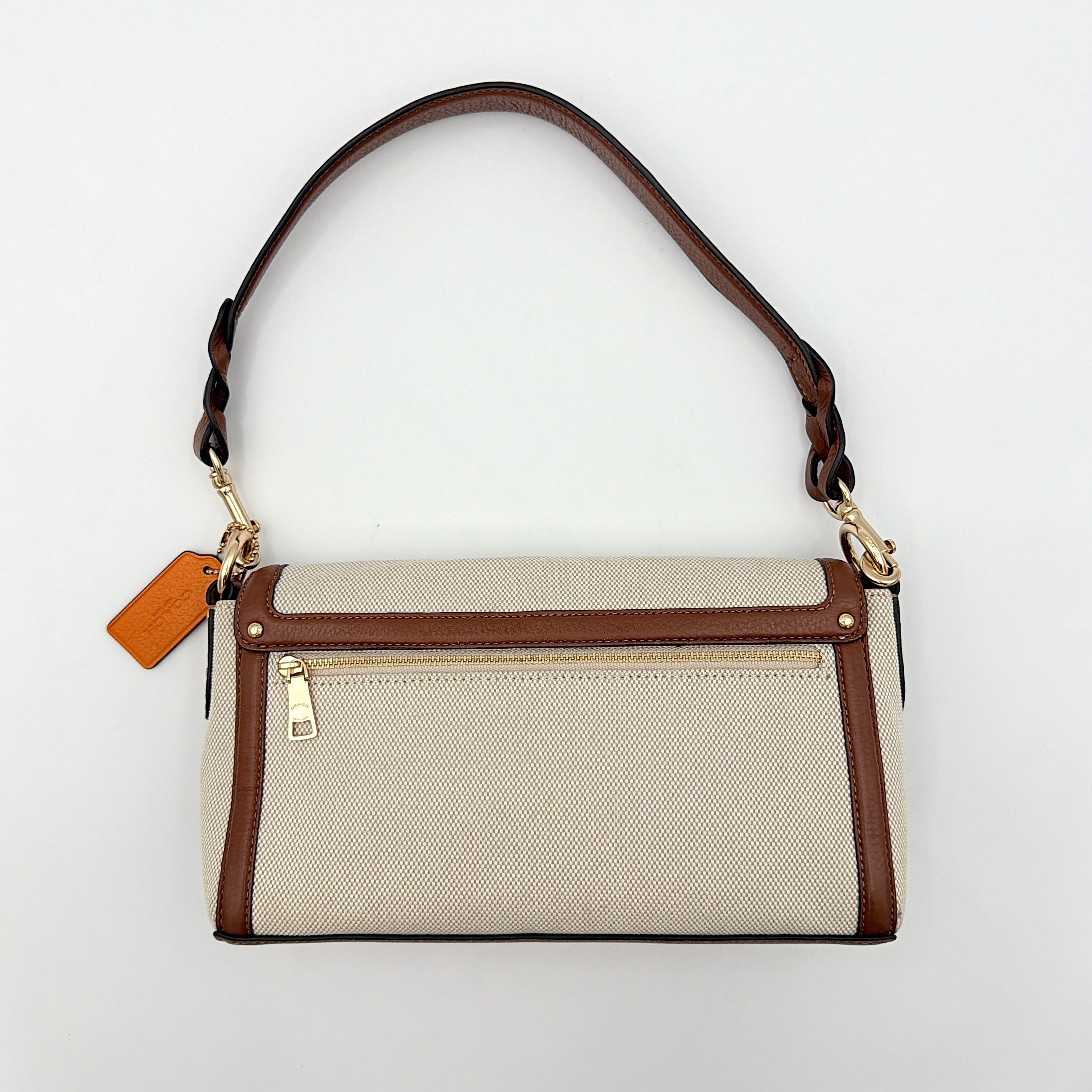 Coach Jade 2Way Shoulder Bag in sand canvas with amber and brown leather trim, gold-tone carriage hardware, and detachable strap.