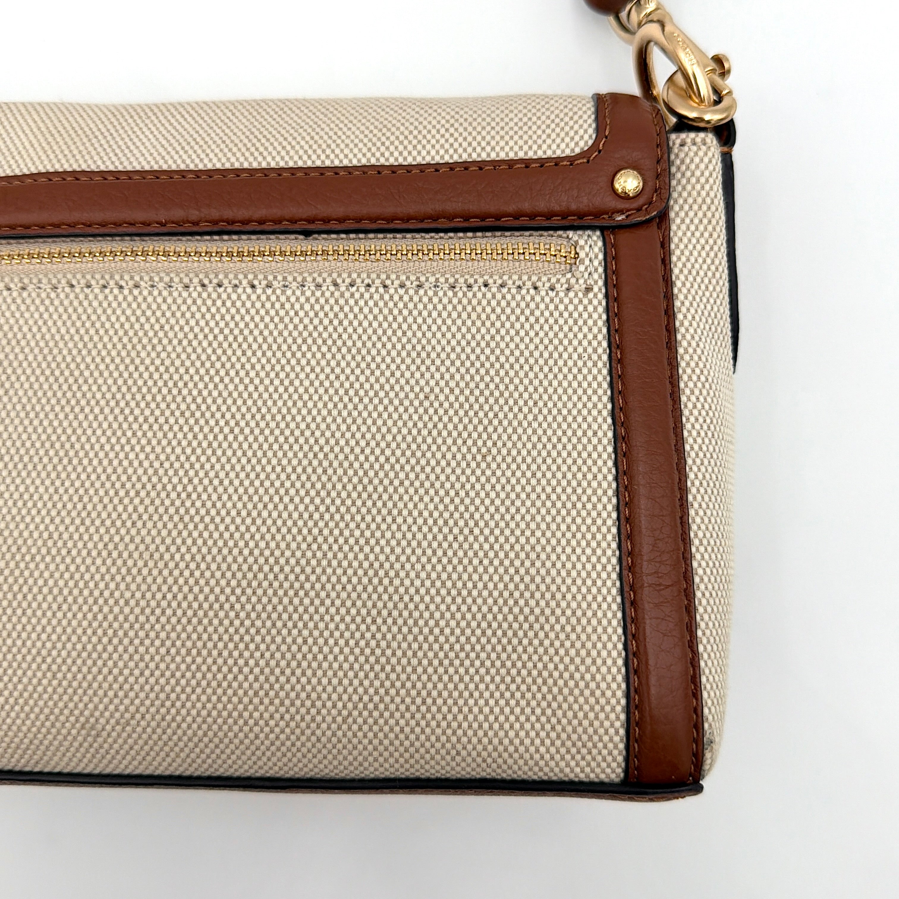 Coach Jade 2Way Shoulder Bag in sand canvas with amber and brown leather trim, gold-tone carriage hardware, and detachable strap.