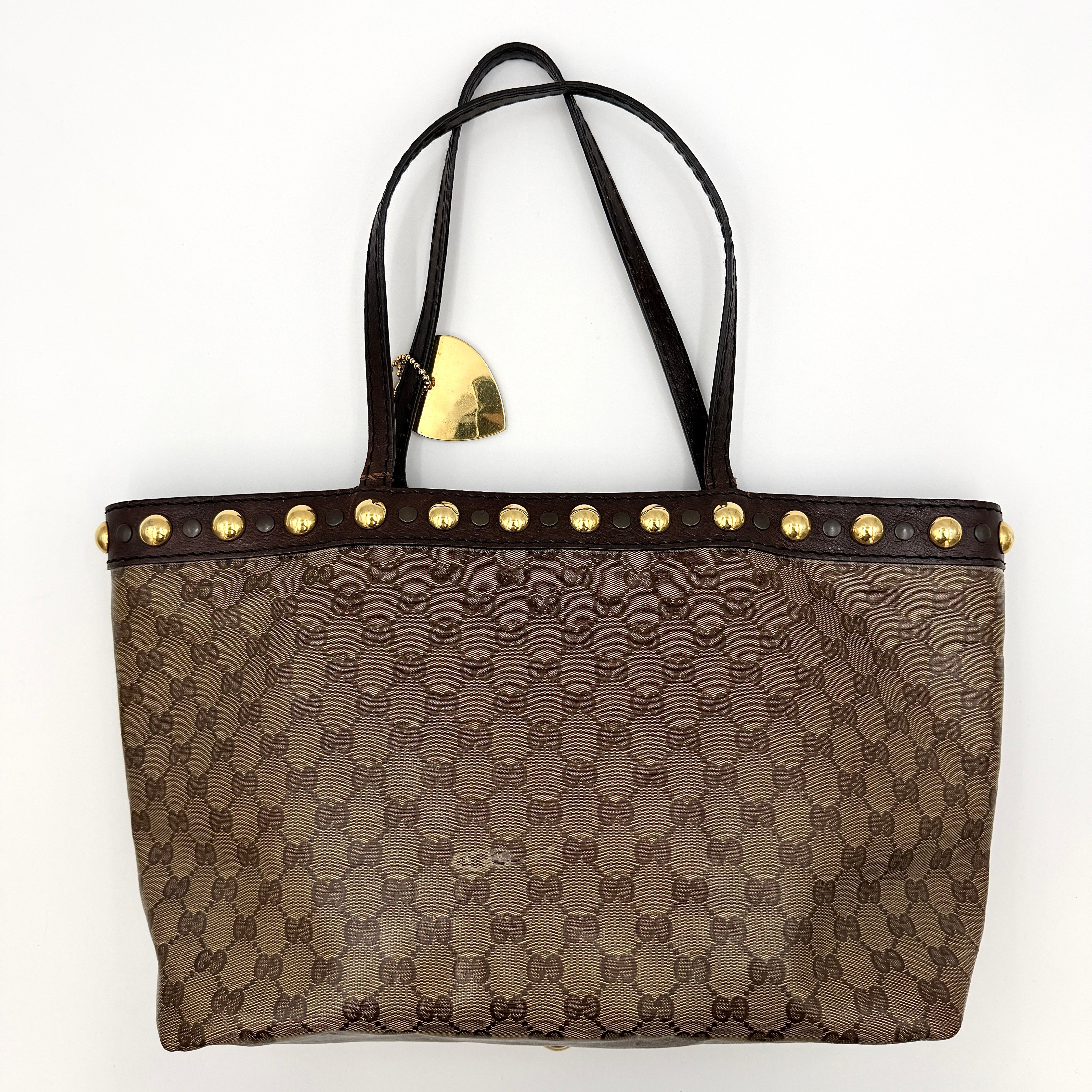 Gucci Babouska shoulder bag in GG monogram crystal canvas with gold-tone stud details and brown leather trim.