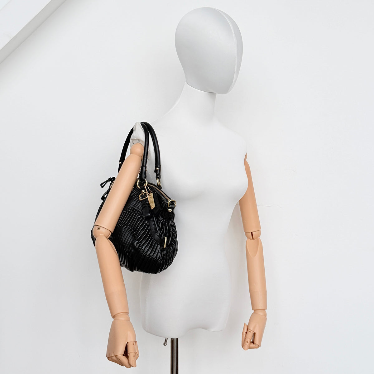 Coach Sophia Madison Pleated Shoulder Bag in black leather with gold hardware and detachable strap.
