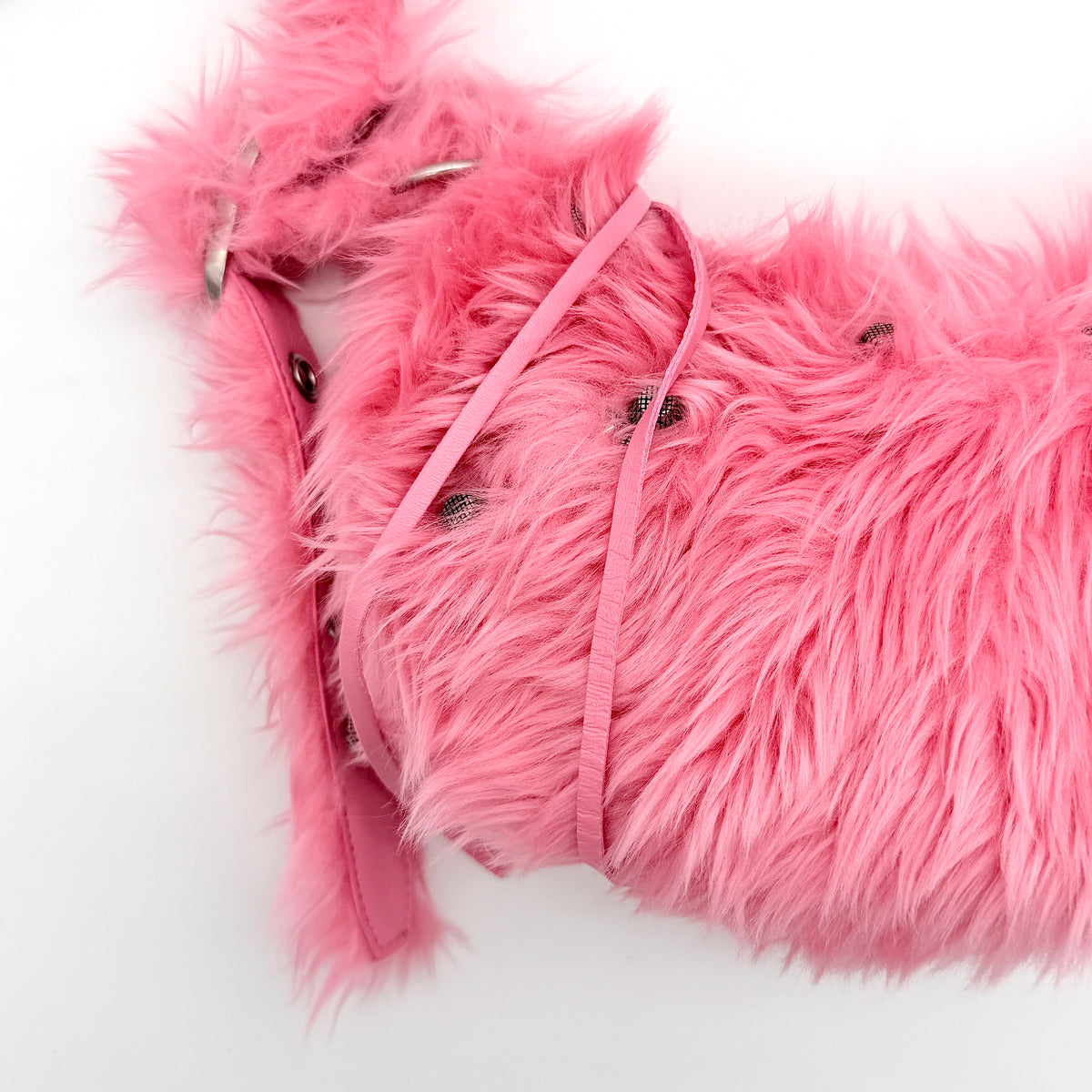 Balenciaga XS Le Cagole Shoulder Bag in sweet pink faux fur with heart-shaped mirror charm and silver hardware, styled on its original dust bag.