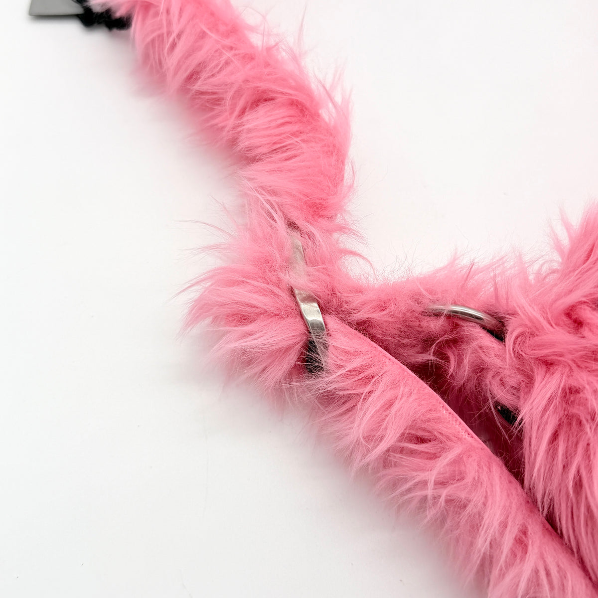 Balenciaga XS Le Cagole Shoulder Bag in sweet pink faux fur with heart-shaped mirror charm and silver hardware, styled on its original dust bag.