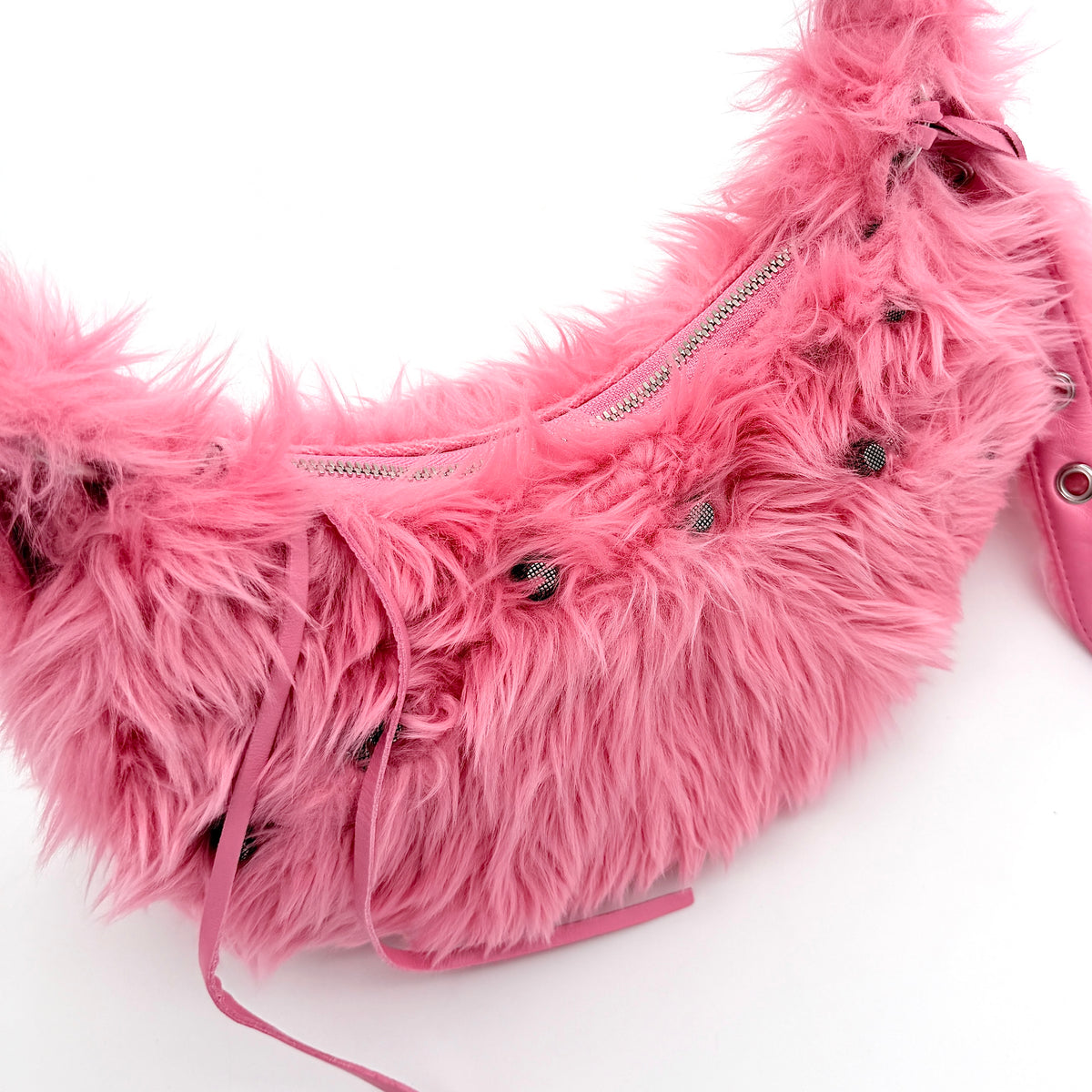 Balenciaga XS Le Cagole Shoulder Bag in sweet pink faux fur with heart-shaped mirror charm and silver hardware, styled on its original dust bag.