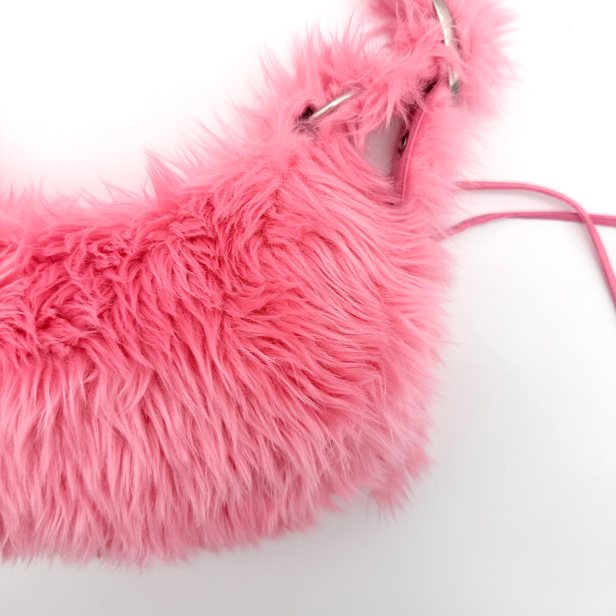 Balenciaga XS Le Cagole Shoulder Bag in sweet pink faux fur with heart-shaped mirror charm and silver hardware, styled on its original dust bag.