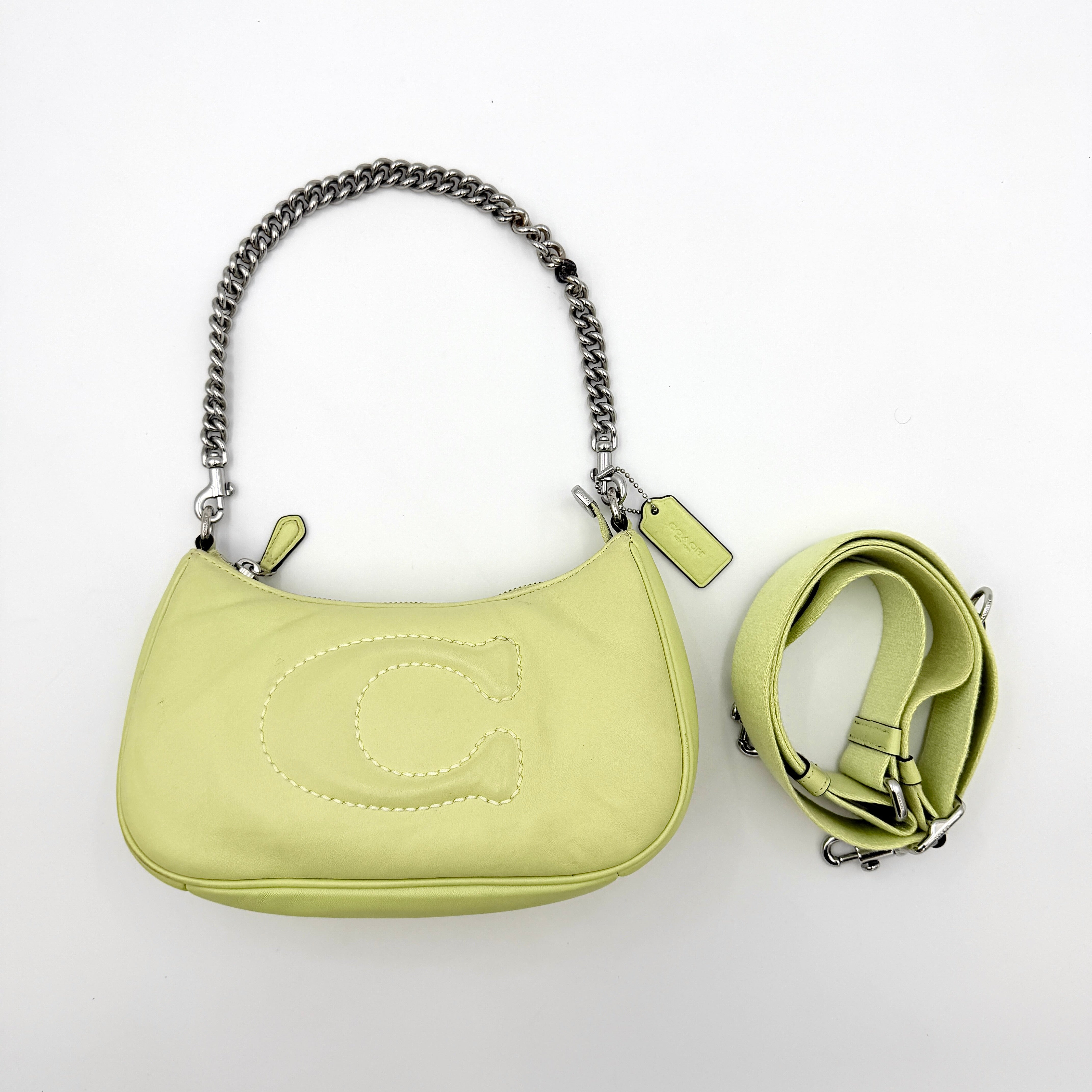 Coach 2Way C Teri Quilted Shoulder Bag in pastel green leather with oversized chain handle and detachable strap, displayed against a clean background.