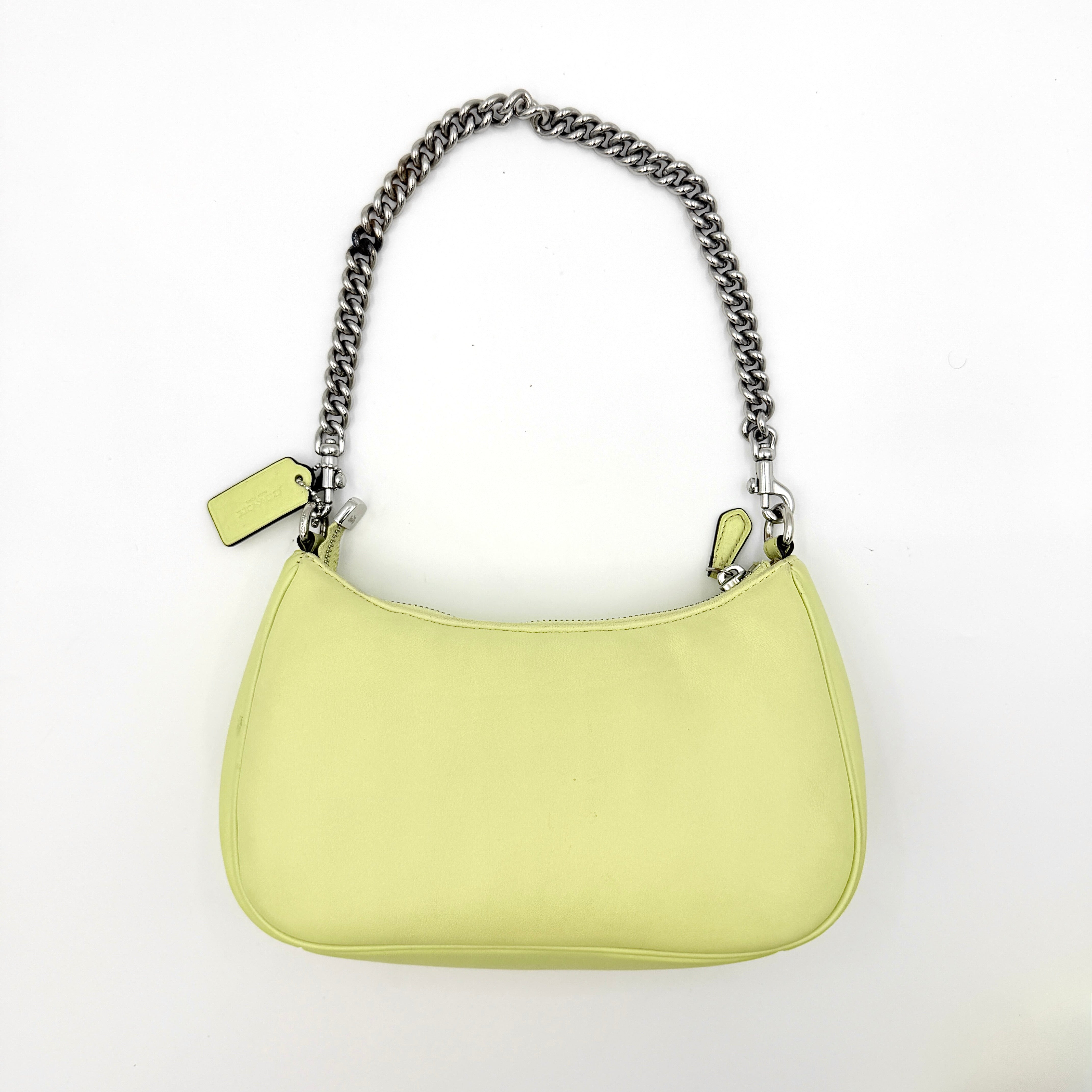 Coach 2Way C Teri Quilted Shoulder Bag in pastel green leather with oversized chain handle and detachable strap, displayed against a clean background.