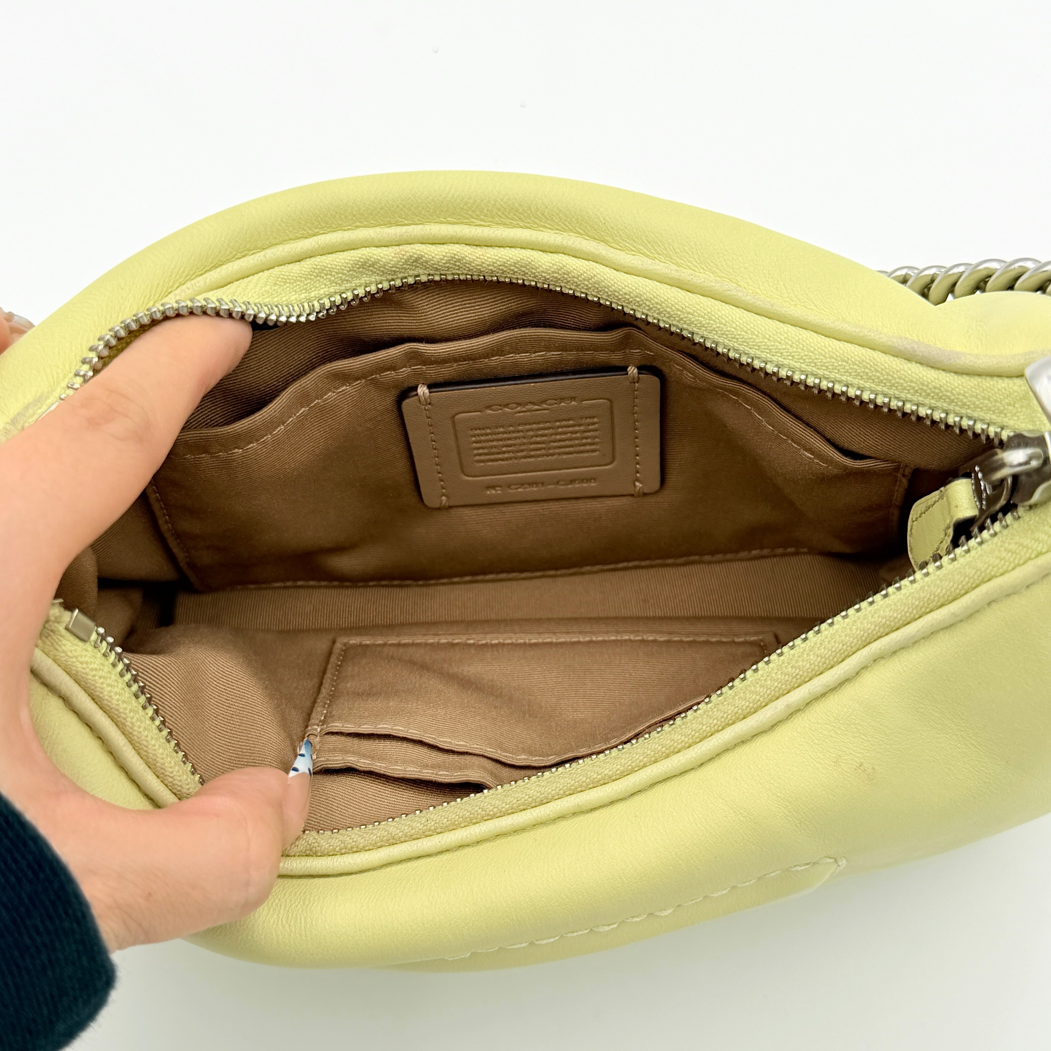 Coach 2Way C Teri Quilted Shoulder Bag in pastel green leather with oversized chain handle and detachable strap, displayed against a clean background.
